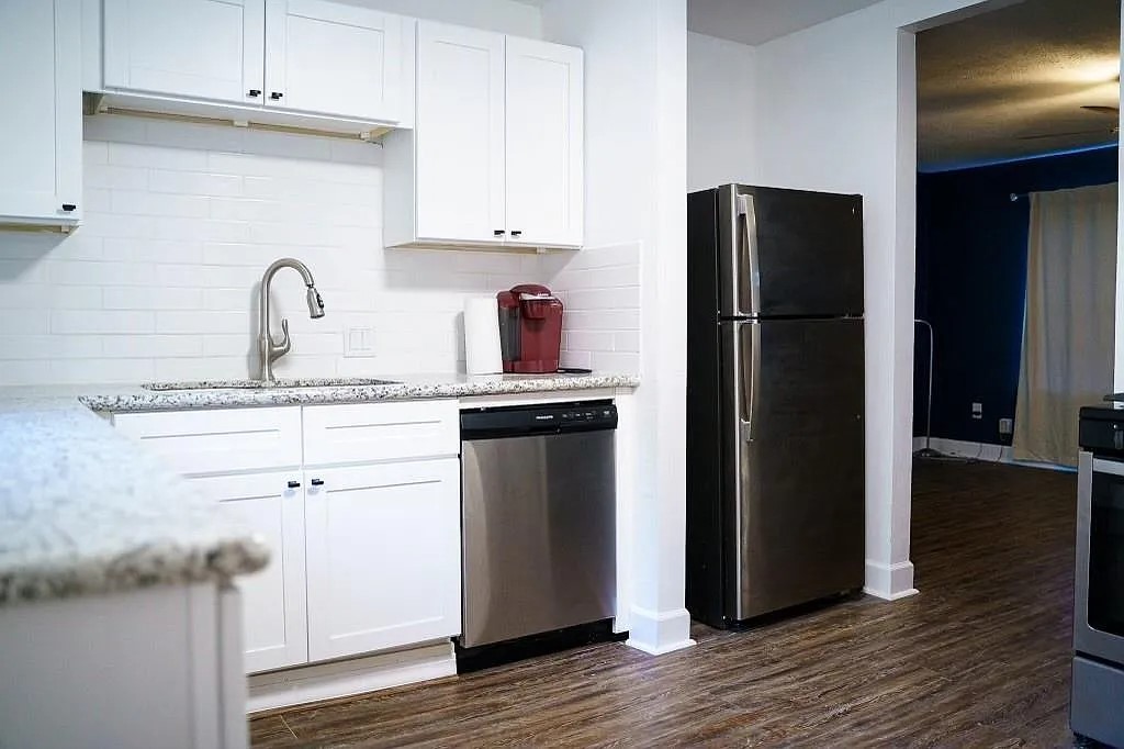 Kitchen with Stainless Steel Refrigerator and Ample Counter Space