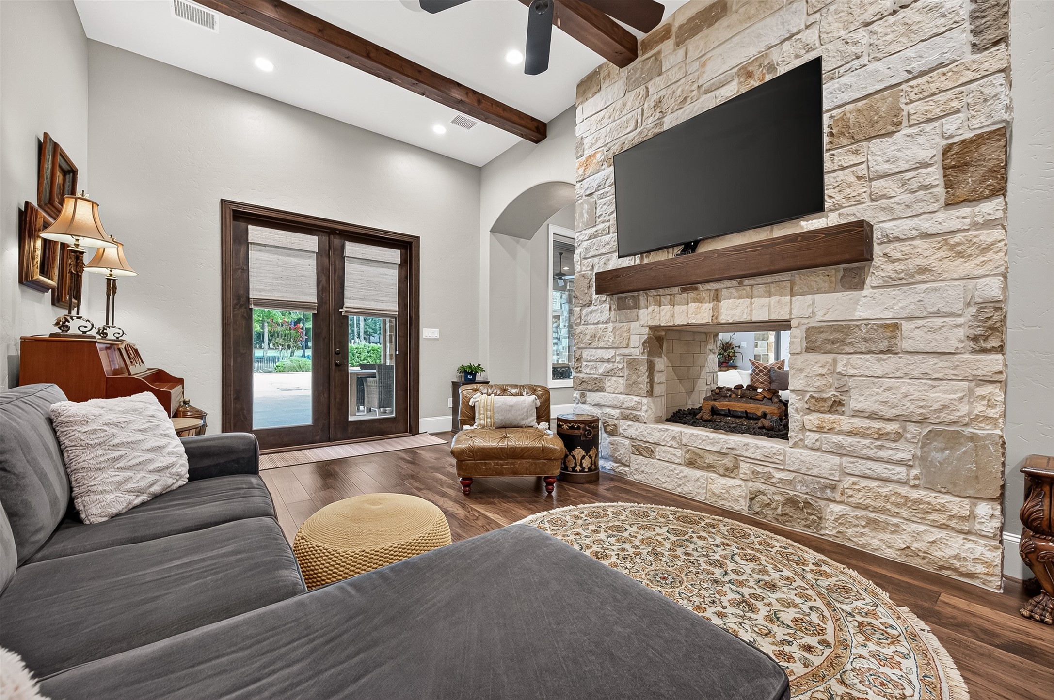 Hearth room with french doors leading to patio and pool.