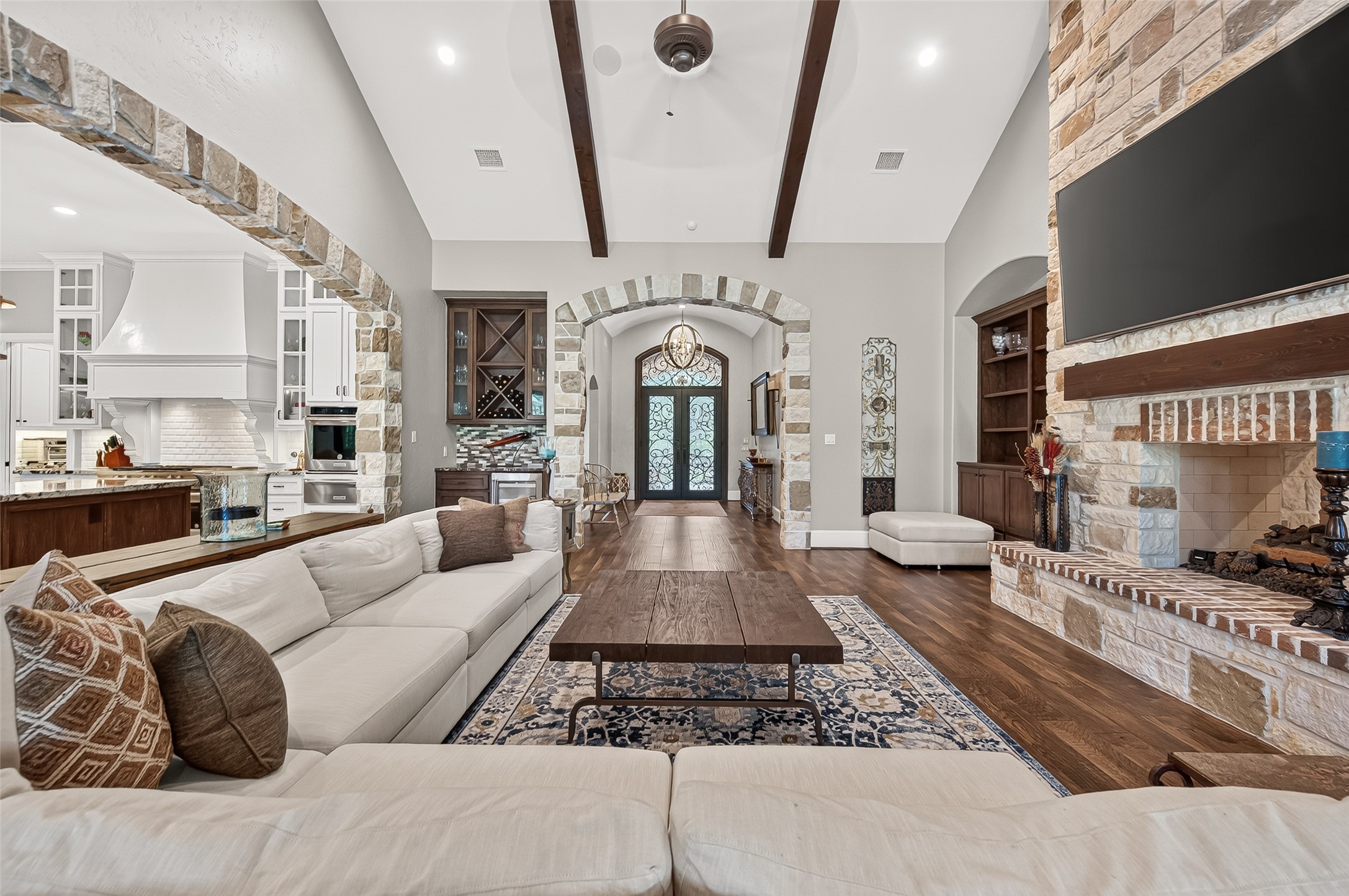 Spacious family room with double sided fireplace. Spacious family room with double sided fireplace.