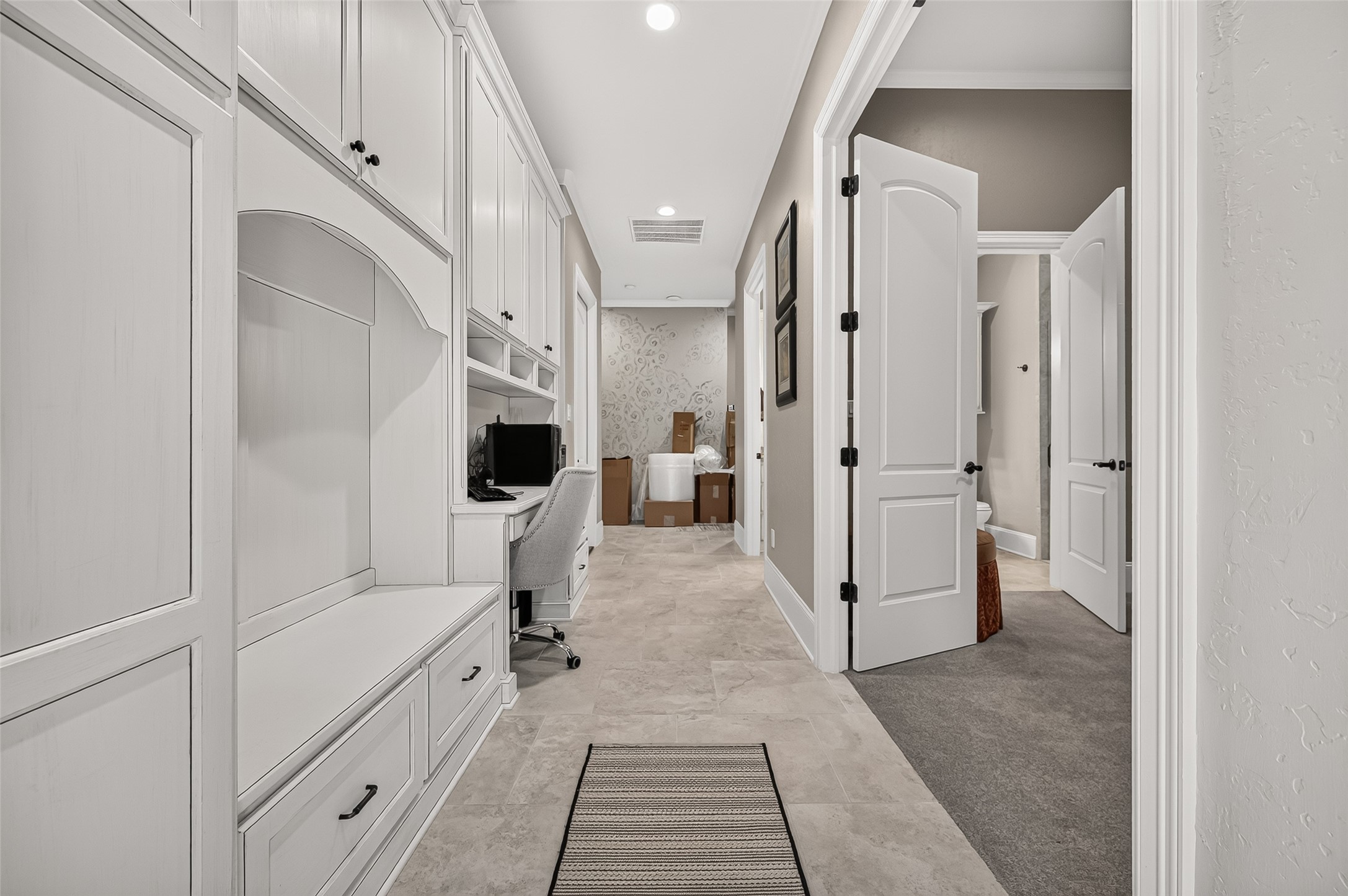 Hallway leading to media room and garage.