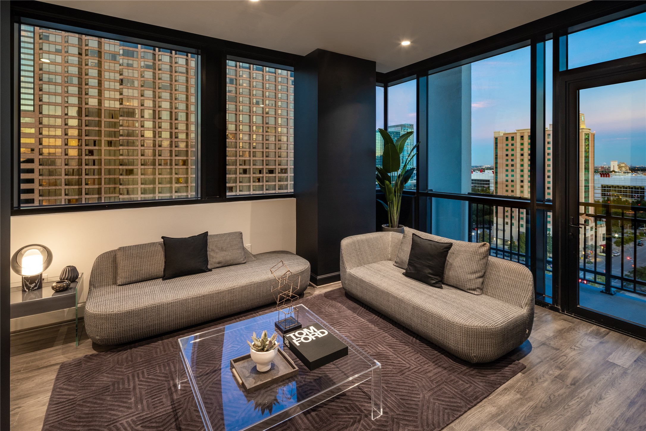 [Living Area VIRTUALLY STAGED]  Experience Houston's dramatic sunsets from the privacy of your living room and balcony