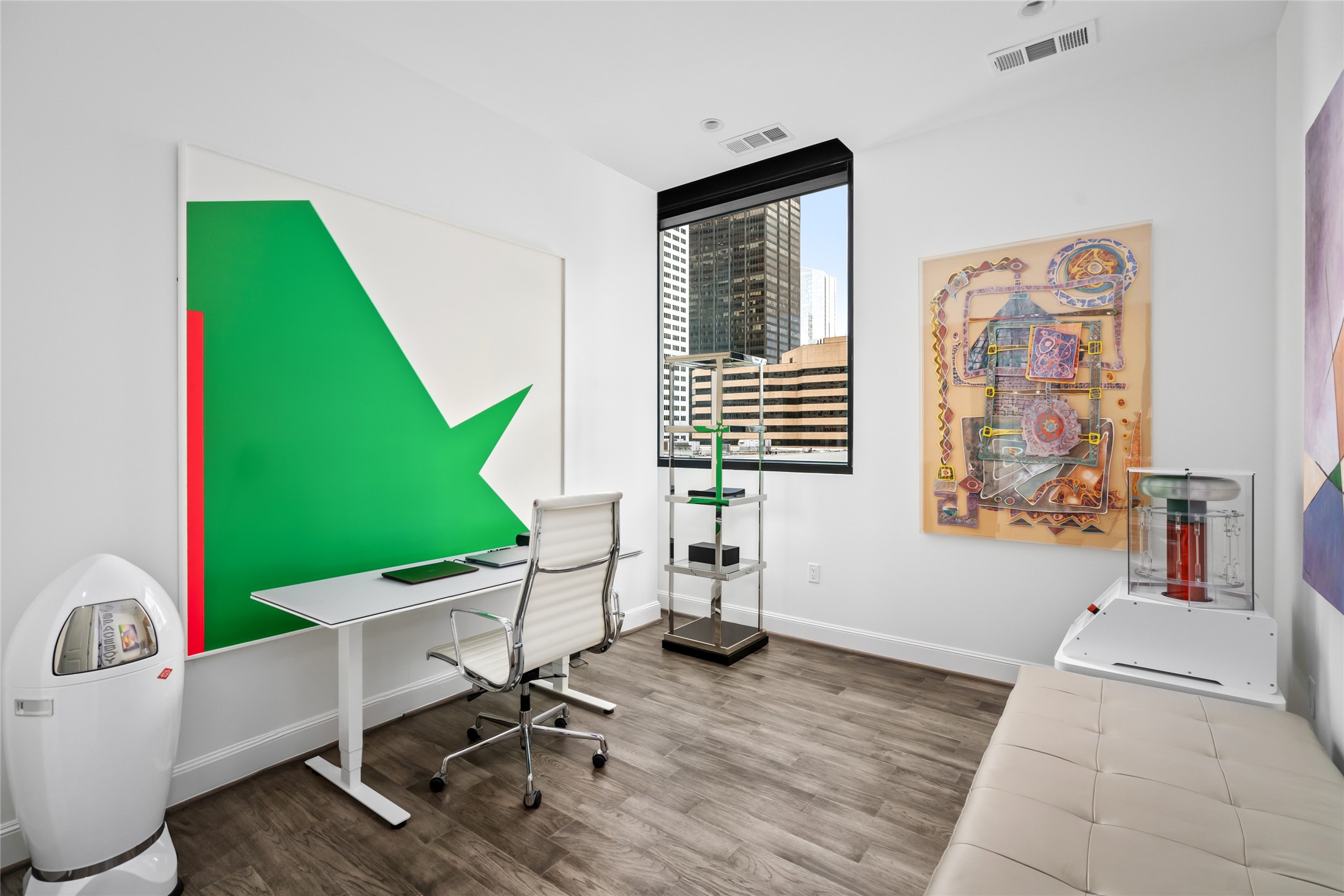 [Secondary Bedroom] Currently utilized as a home office.   The perfect amount of light, and great wall space for artwork or book shelves