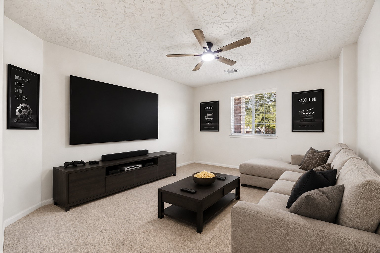 SPACIOUS MEDIA ROOM WITH A CARPET FLOORING, CEILING FAN, AND NATURAL LIGHT FROM THE OVERSIZED WINDOW. *Virtually staged.
