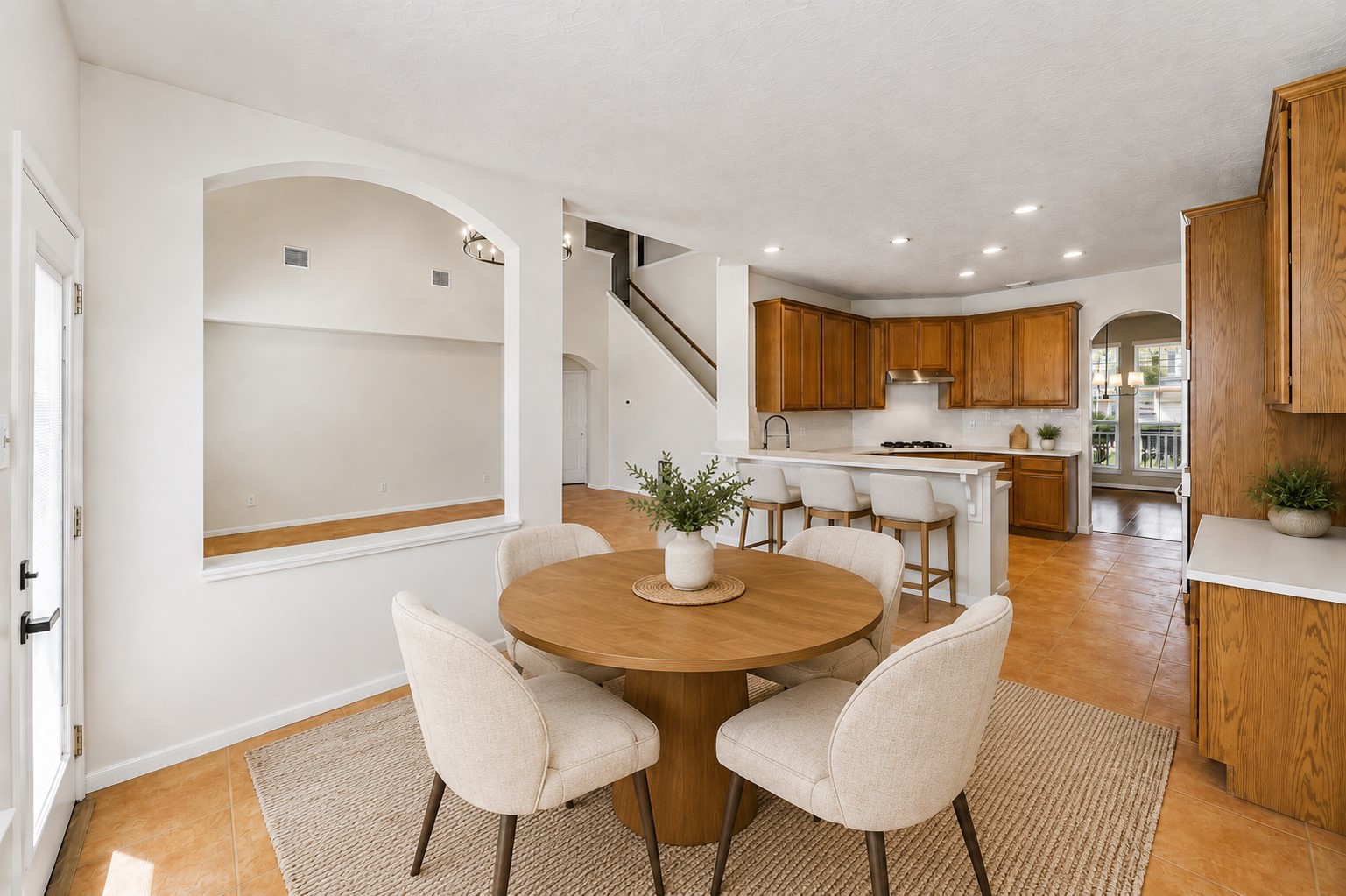 BRIGHT BREAKFAST AREA WITH AN OPEN CONNECTION TO THE KITCHEN, GENEROUS FLOOR SPACE, AND EASY ACCESS TO THE BACKYARD. *Virtually staged.