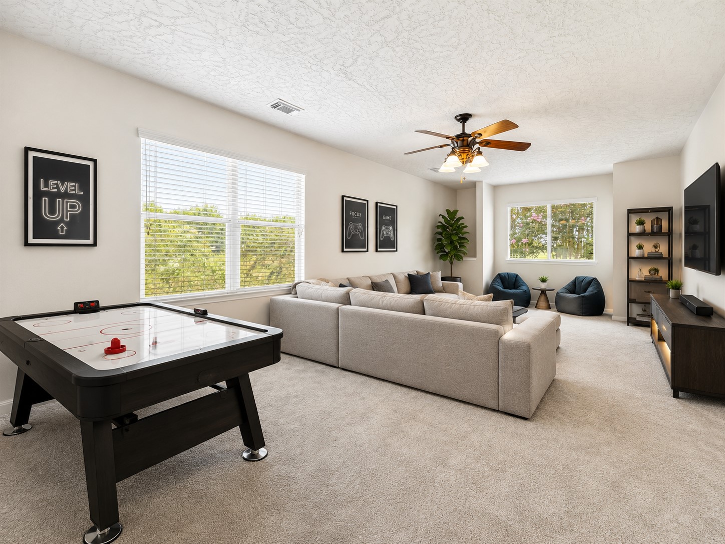 EXPANSIVE UPSTAIRS GAME ROOM WITH MULTIPLE WINDOWS, GENEROUS WALL SPACE, AND ROOM FOR SEVERAL ENTERTAINMENT ZONES. *Virtually staged.