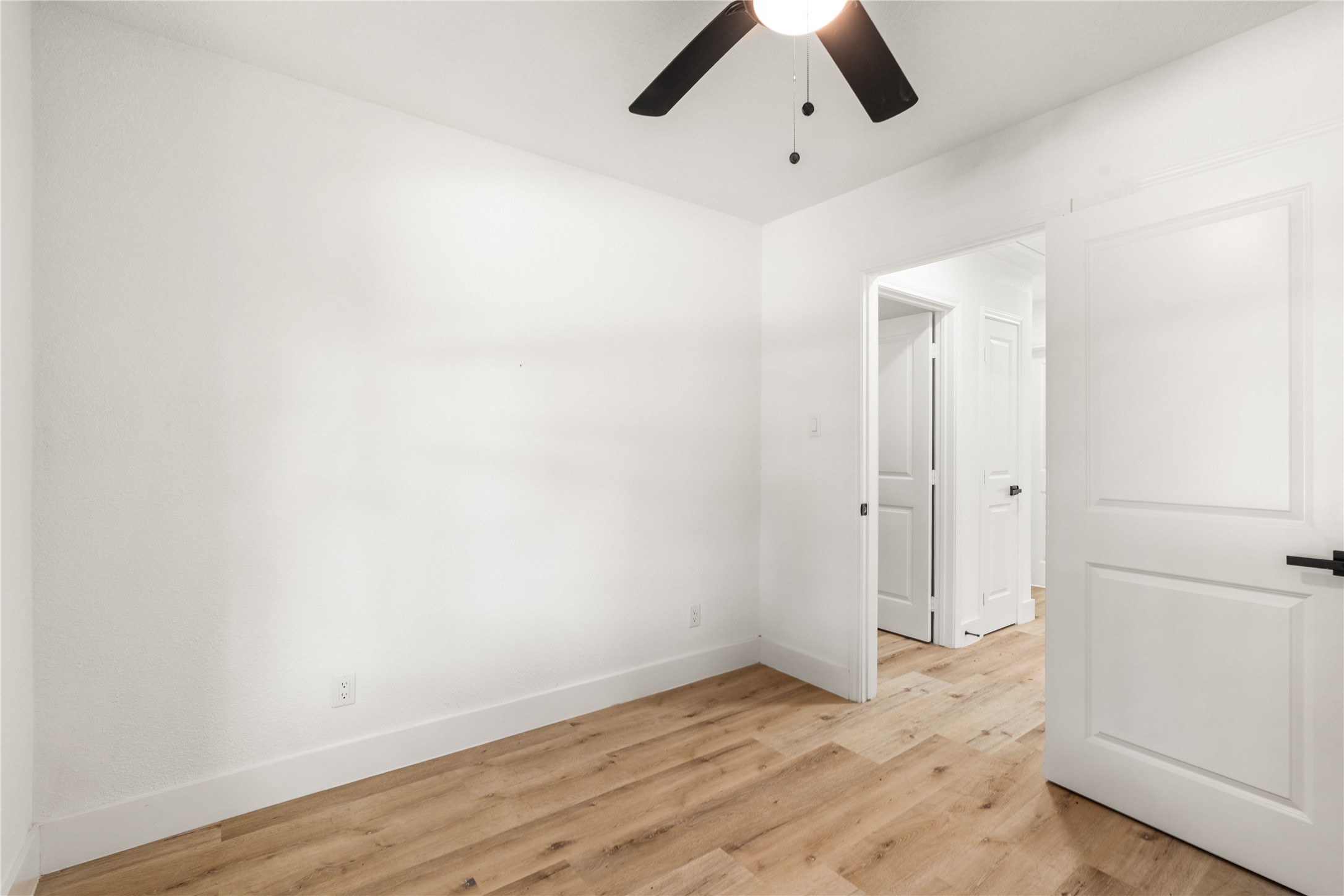 Another view of Bedroom featuring access to the closet and hallway.