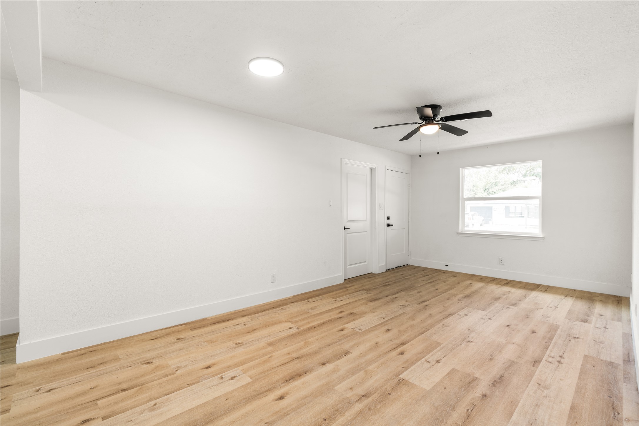 Another angle of Living Area with Bright reverse view framed by abundant light from the front-facing window. Another angle of Living Area with Bright reverse view framed by abundant light from the front-facing window.