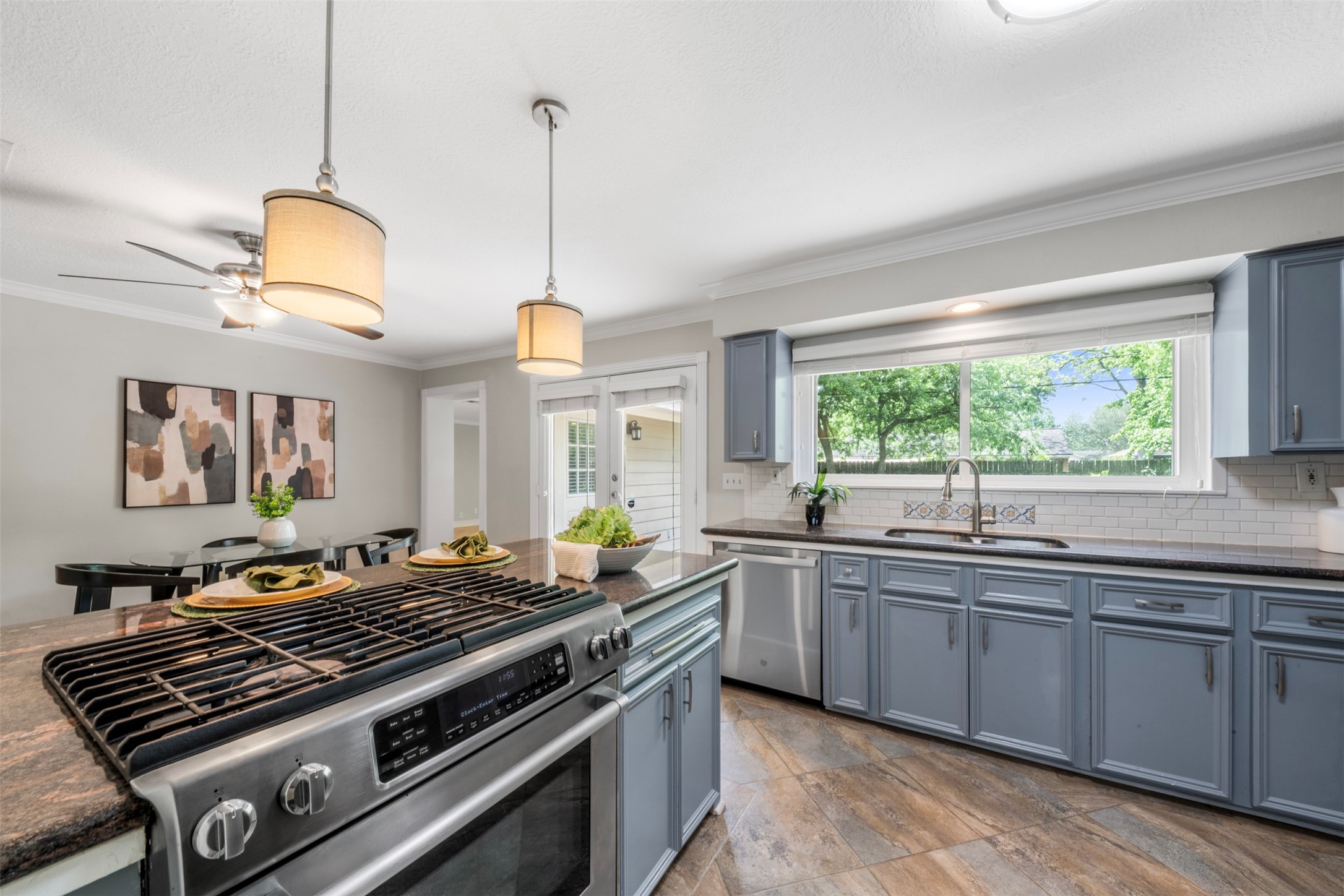 Having a large window over the sink allows for outdoor views, making dishwashing easier.