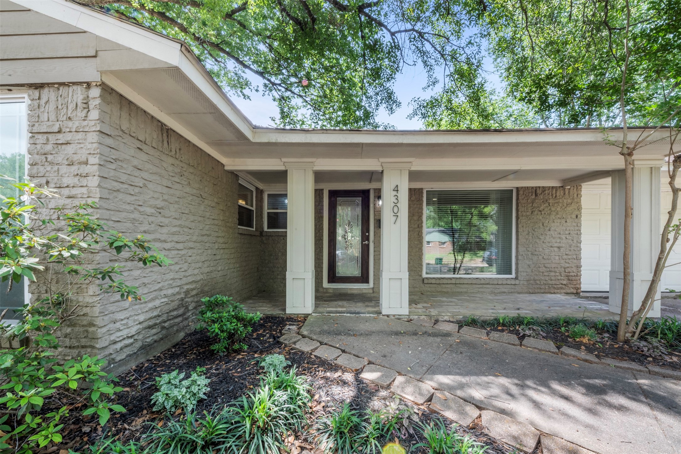 Welcome to 4307 Spellman. Add some rocking chairs or a swing and enjoy your morning coffee under the porch.