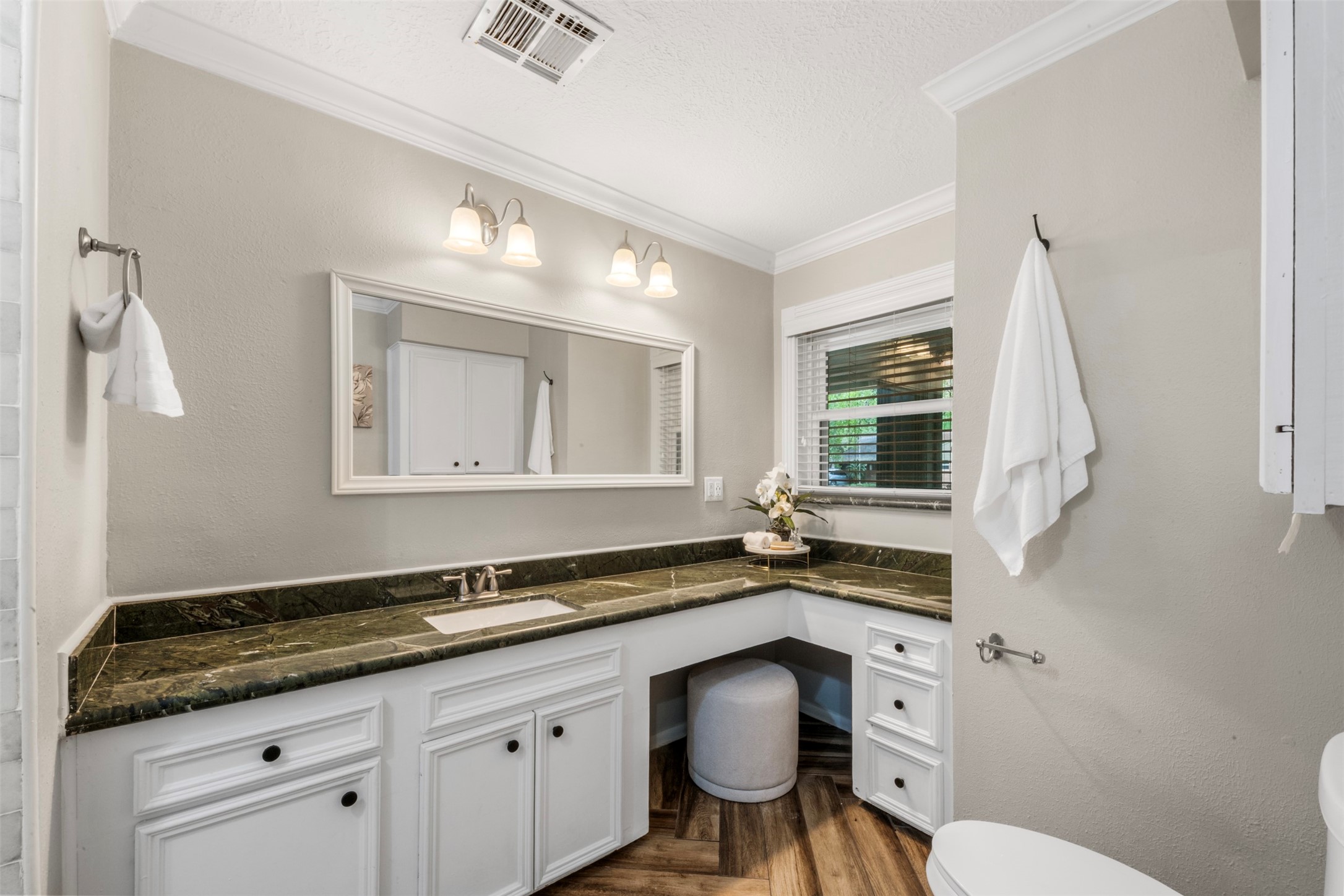 There is plenty of counter and cabinet space in the hall bathroom.