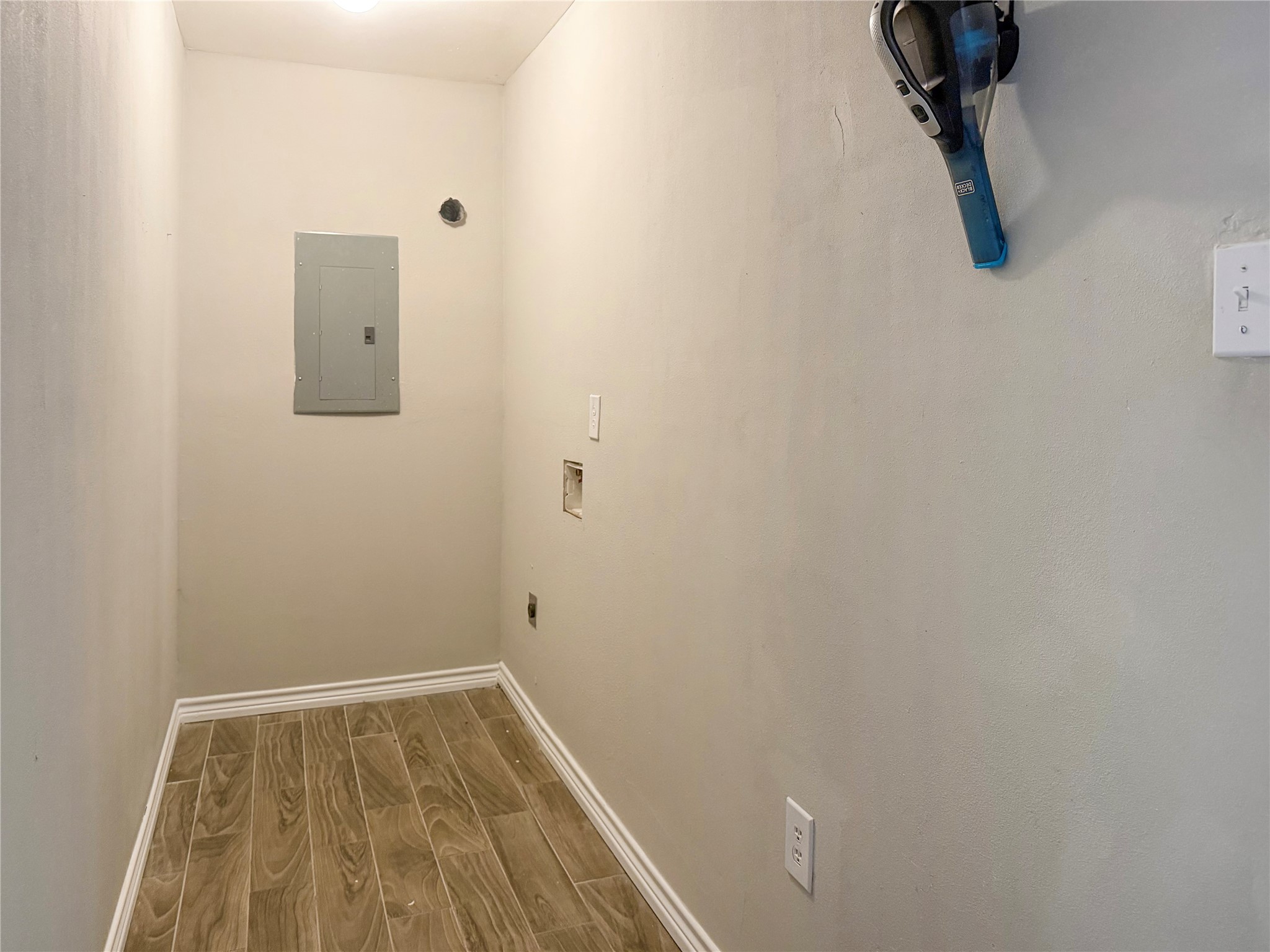 Convenient pass-through laundry room connects the garage to the kitchen, providing easy access and a functional space for everyday laundry needs.