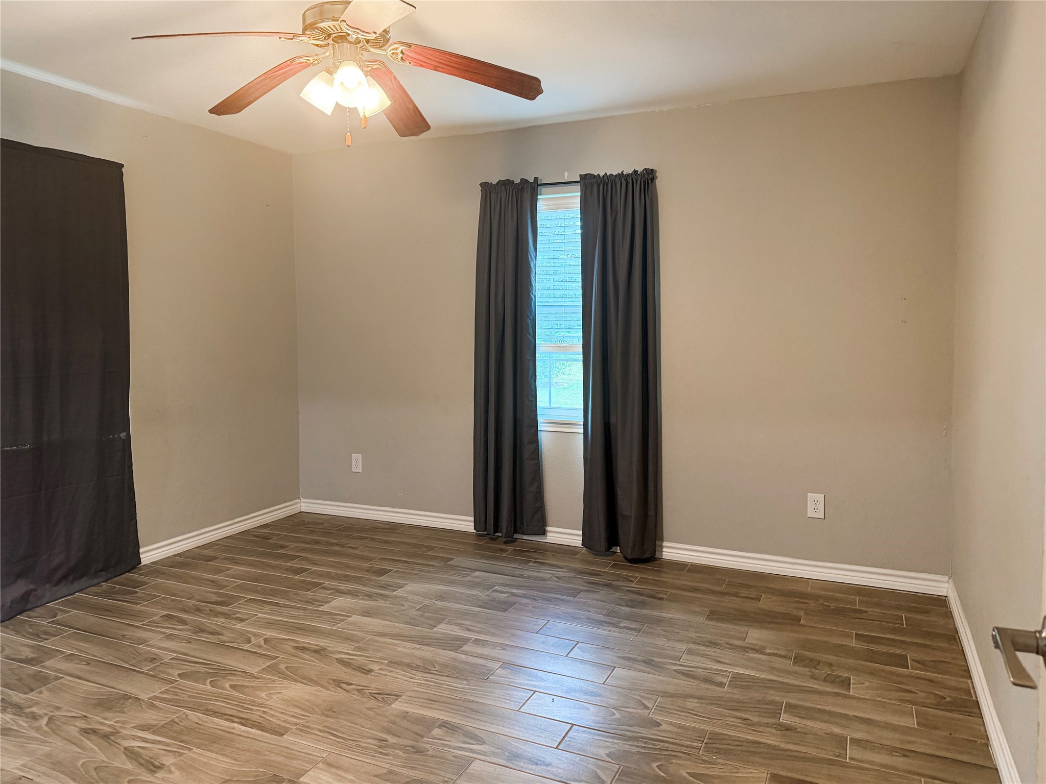 Primary bedroom conveniently located on the first floor, offering easy access and a comfortable space to relax and unwind.