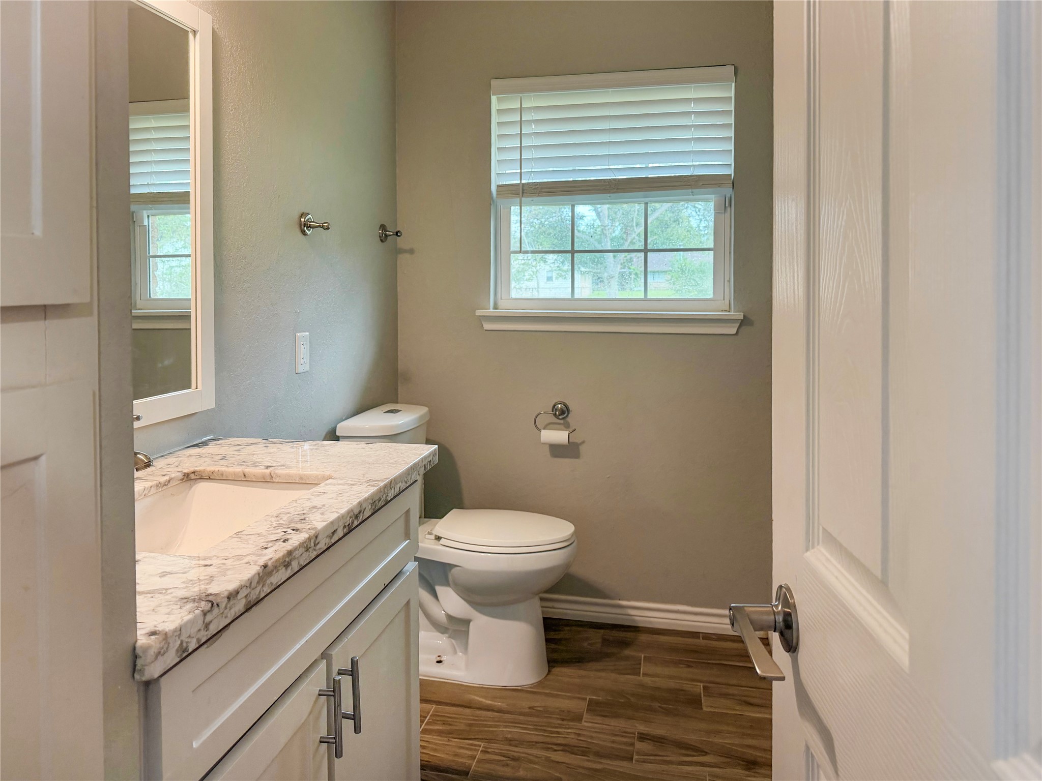 Conveniently located half bath just off the living room, providing easy access for guests and everyday use.