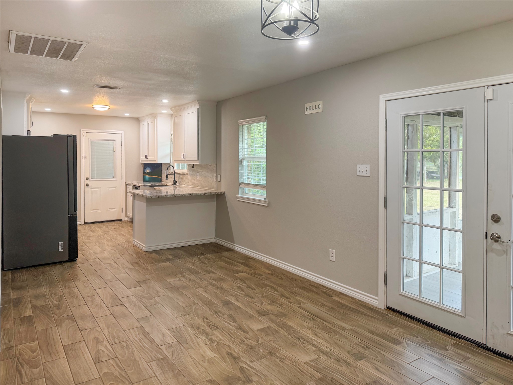 Open dining area flows seamlessly into the kitchen, creating a convenient space for everyday meals and entertaining.