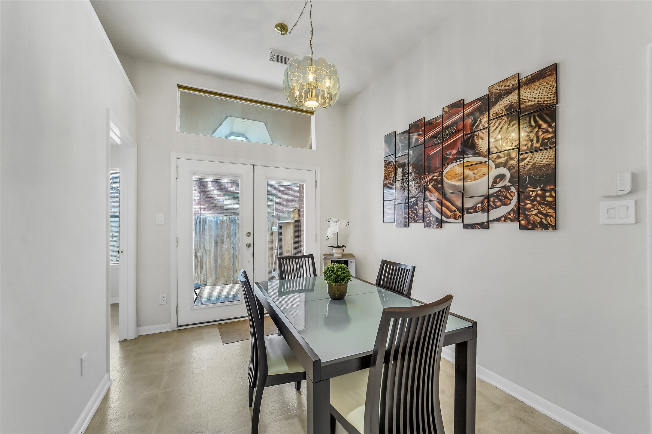 Breakfast with glass French doors to a convenient side patio.
