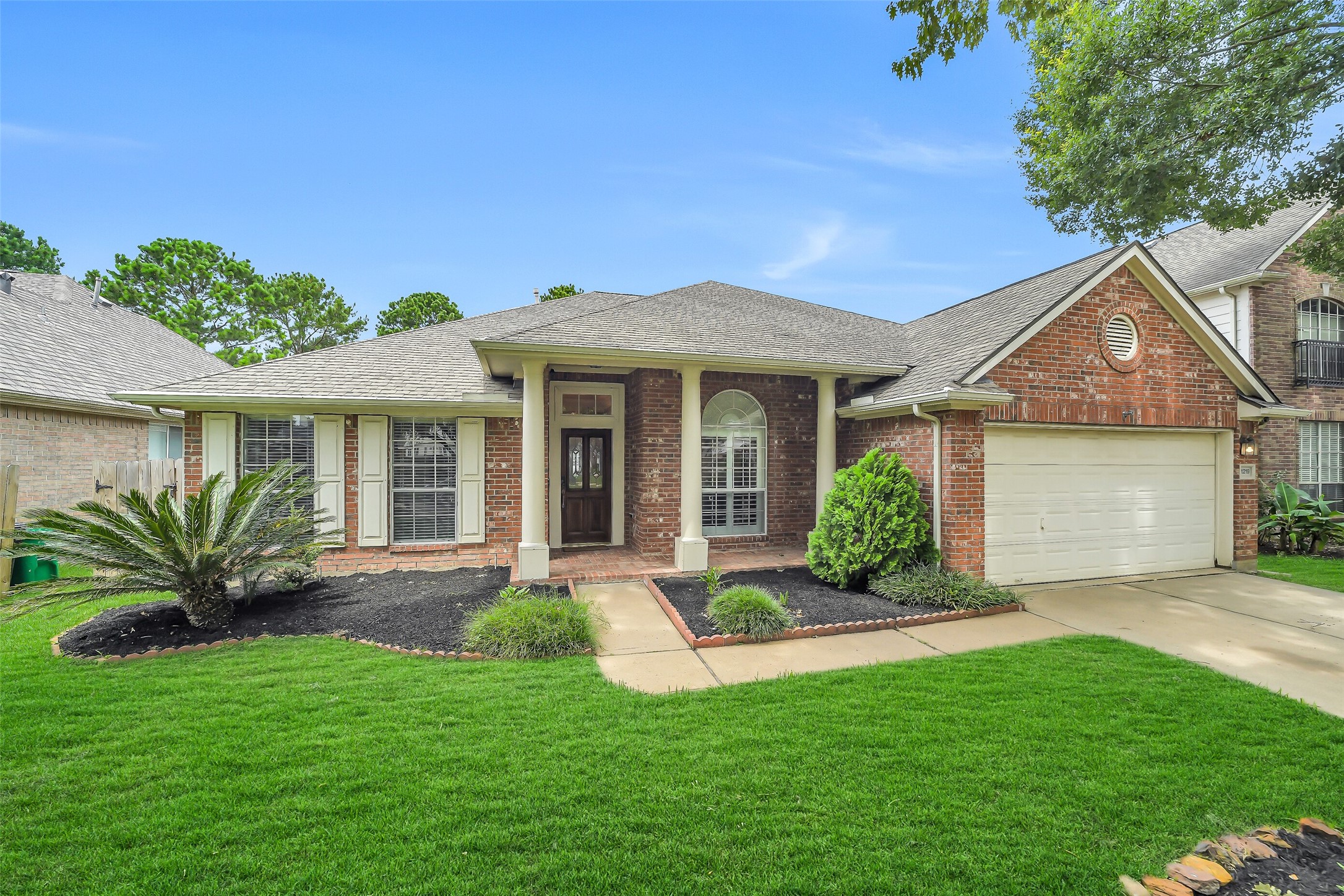 The attractive front elevation is complemented by a beautiful covered front porch, inviting you to enjoy its charm and warmth.