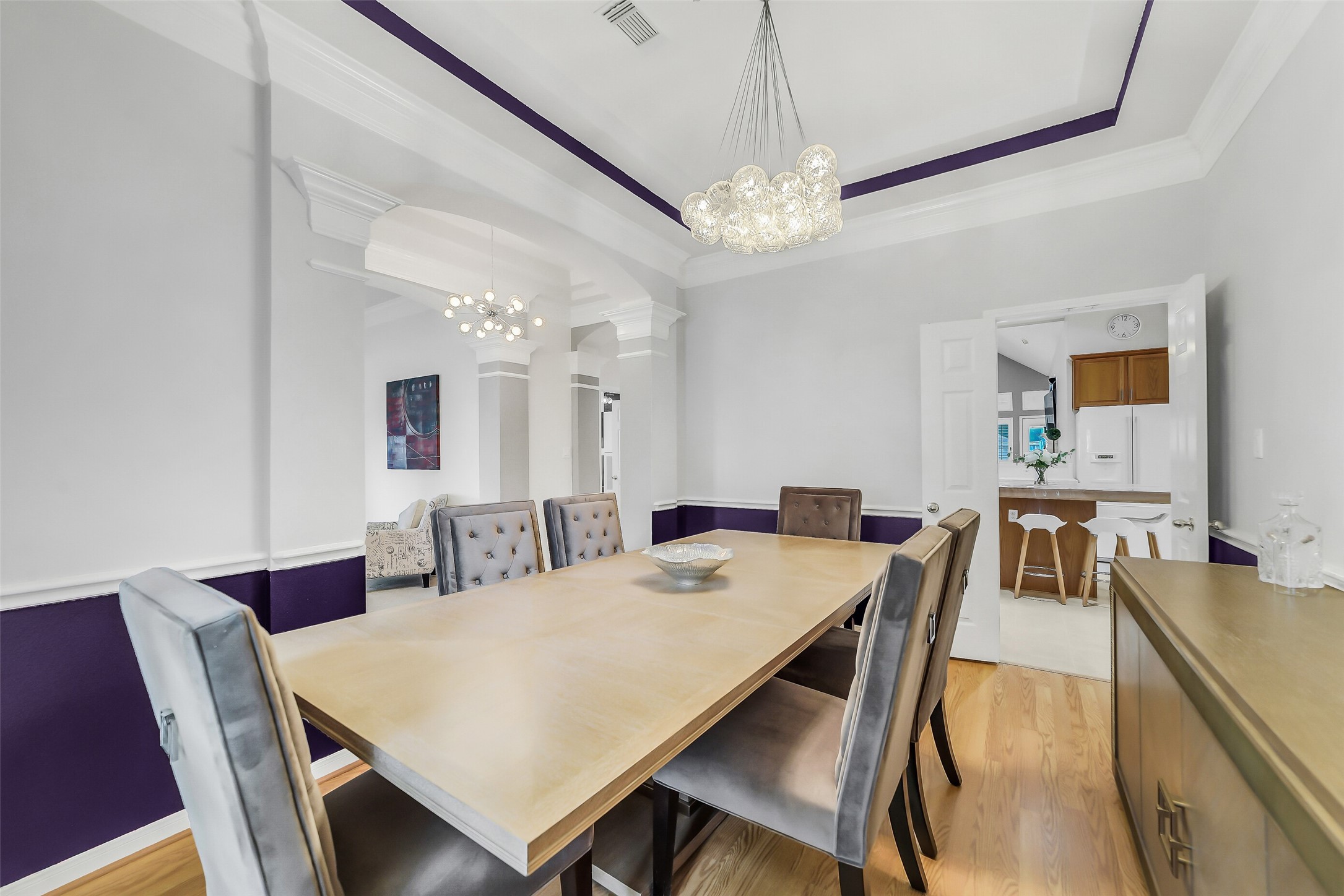 Formal dining room features chair rails custom custom designer colors.