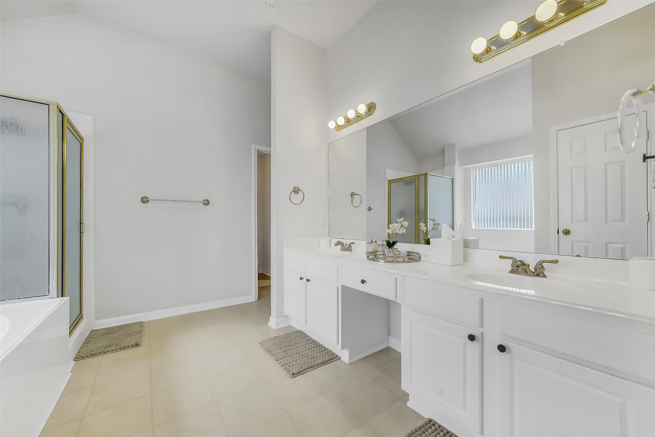 Primary bathroom with stylish his-and-her sink.