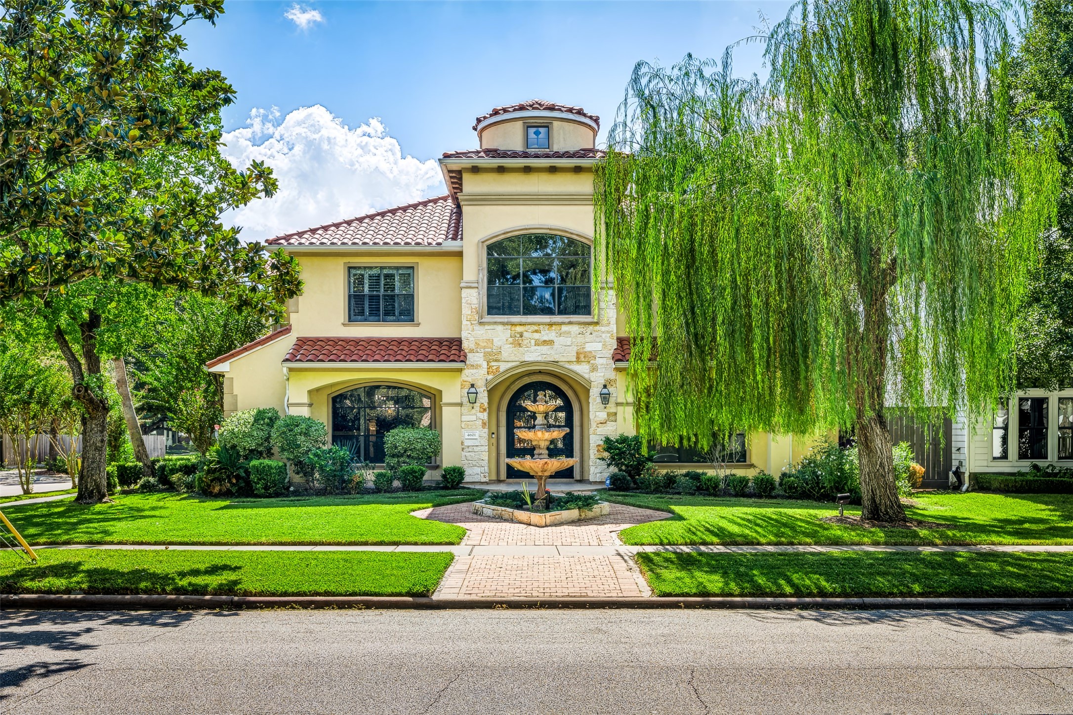 Elegant Mediterranean-style home in the heart of Bellaire. Positioned on a corner lot with, with lush landscaping and water feature that give the home great curb appeal. Elegant Mediterranean-style home in the heart of Bellaire. Positioned on a corner lot with, with lush landscaping and water feature that give the home great curb appeal.
