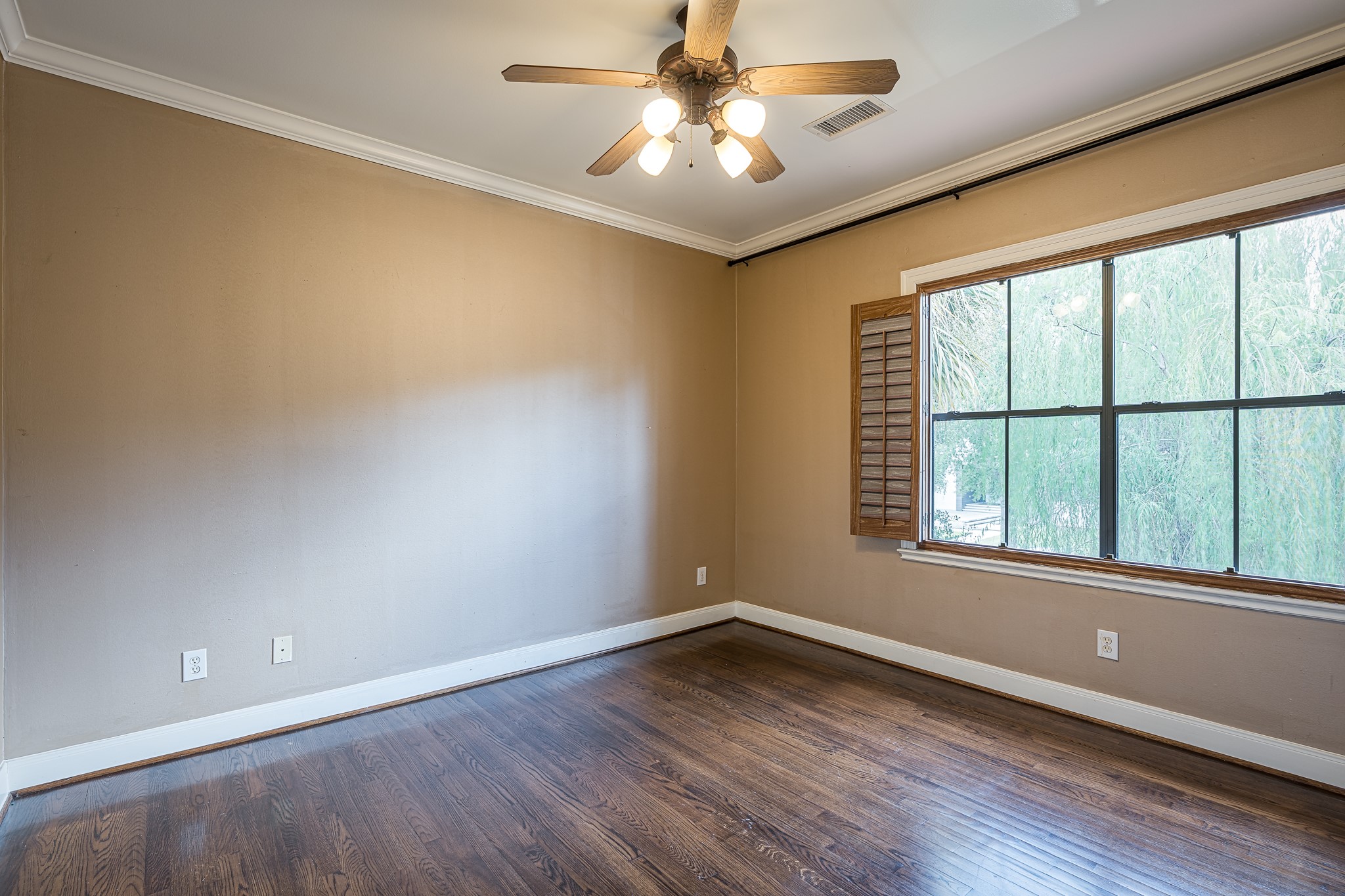 This secondary room on the front side of the home has an en-suite bath and a walk-in closet