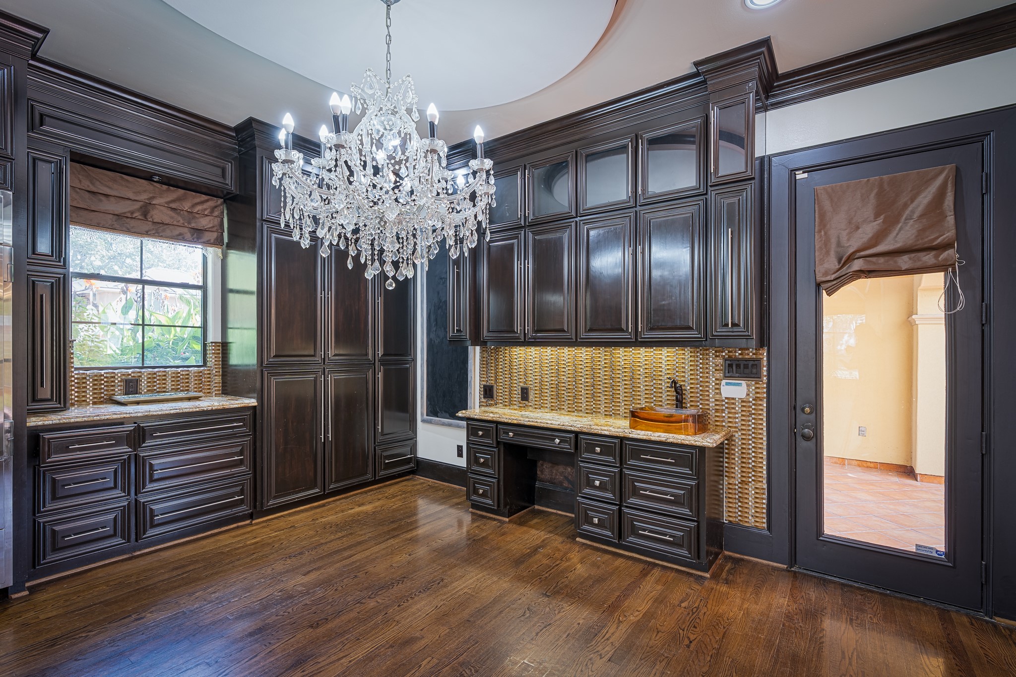 Breakfast room has plenty of storage and a coffe/dry bar.