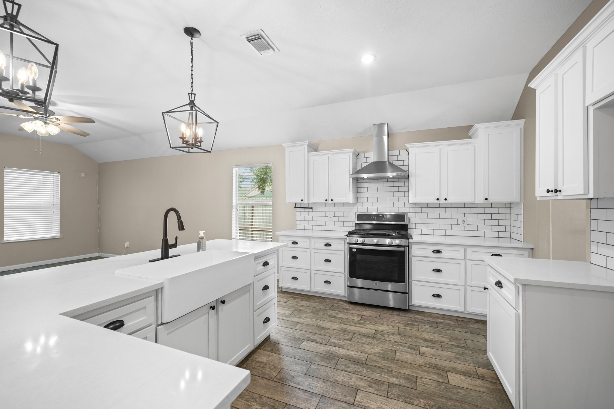 Upgraded light fixtures, farmhouse sink, and stainless steel appliances