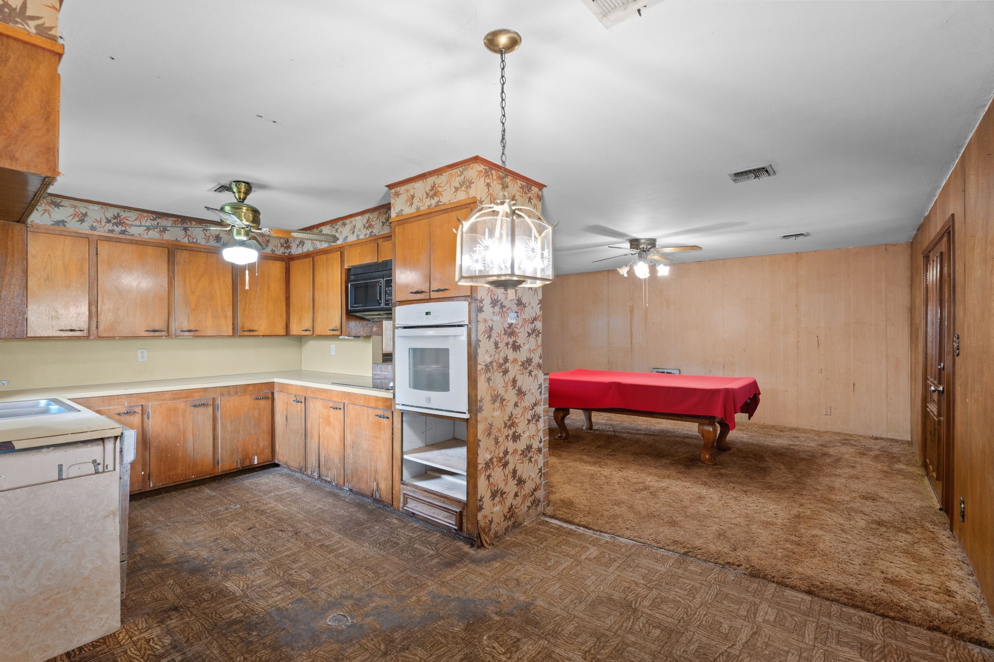 Kitchen opens to an adjoining entertainment area.