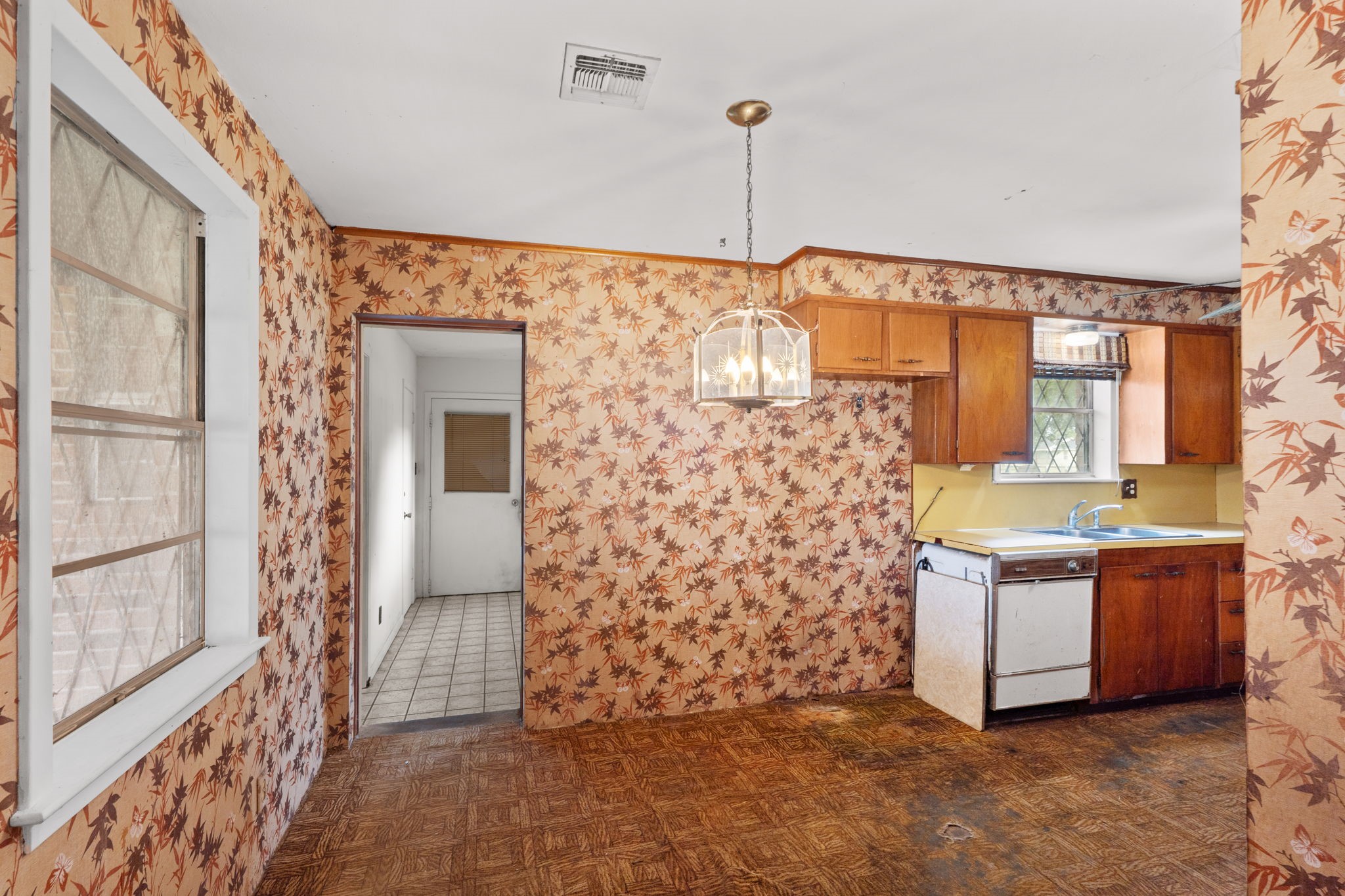 Breakfast nook with kitchen access and natural light.