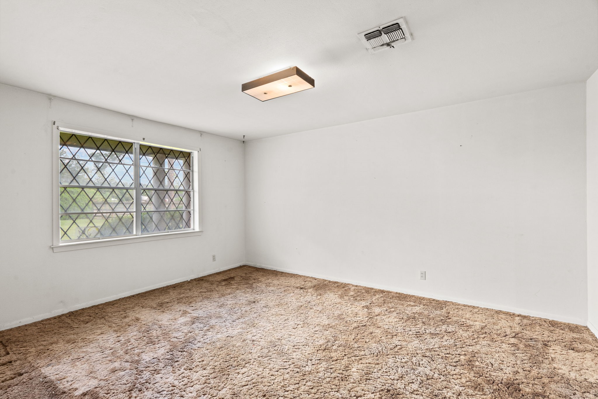 Living area with natural light and neutral walls. Living area with natural light and neutral walls.