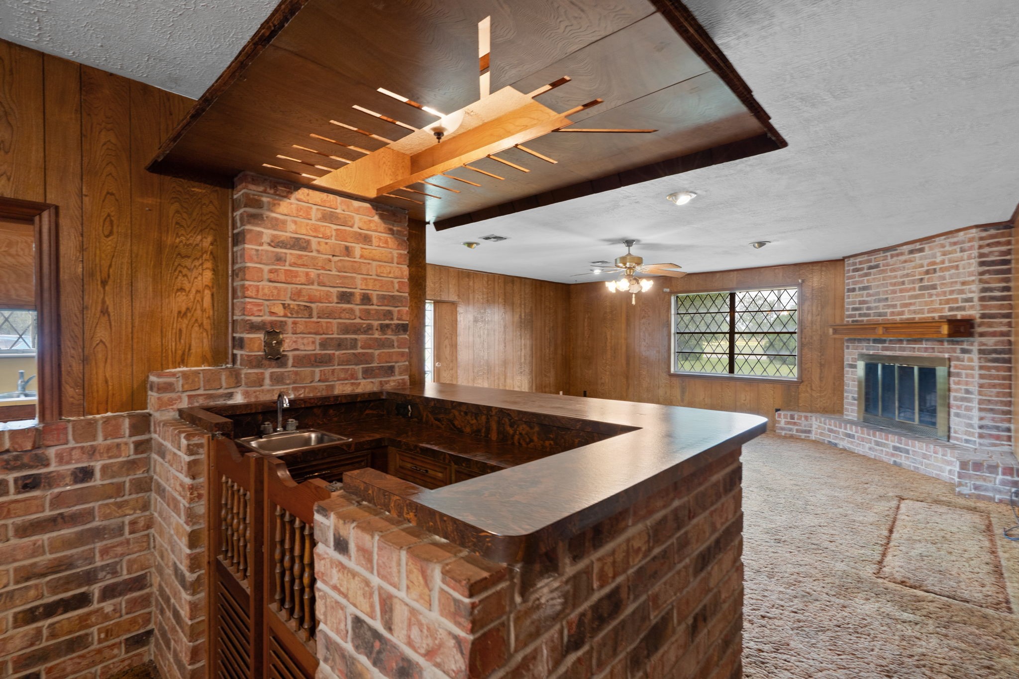 Built-in wet bar with brick surround and ample counter space. Built-in wet bar with brick surround and ample counter space.