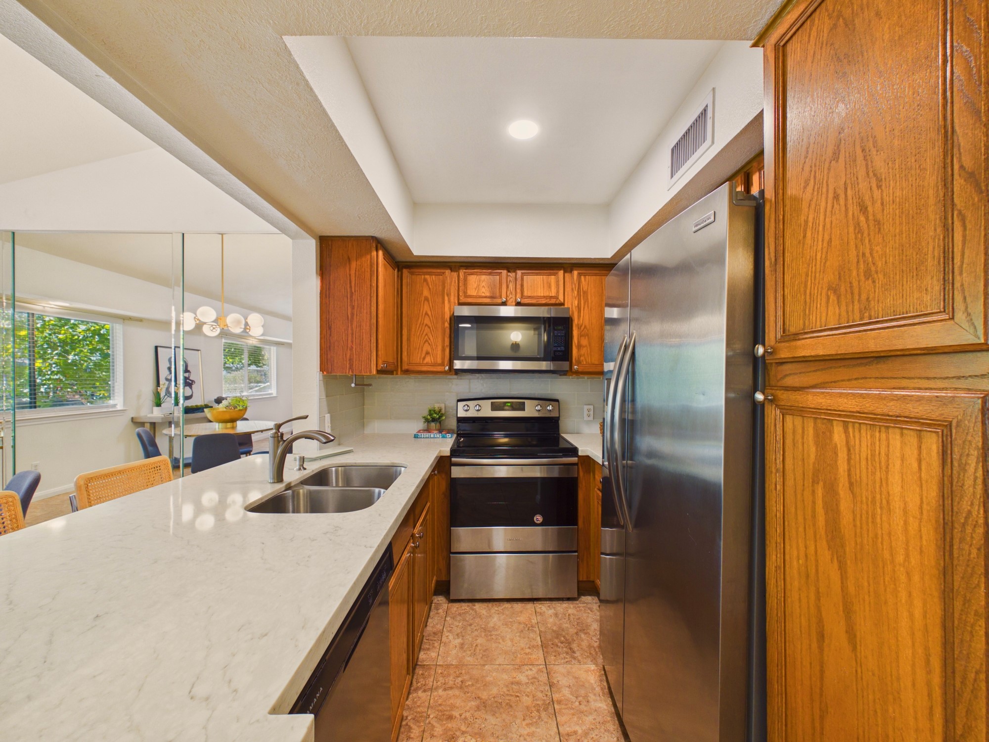 Undermounted Double Sink and Stainless Steel French Door Refrigerator, Dishwasher, Range & Microwave