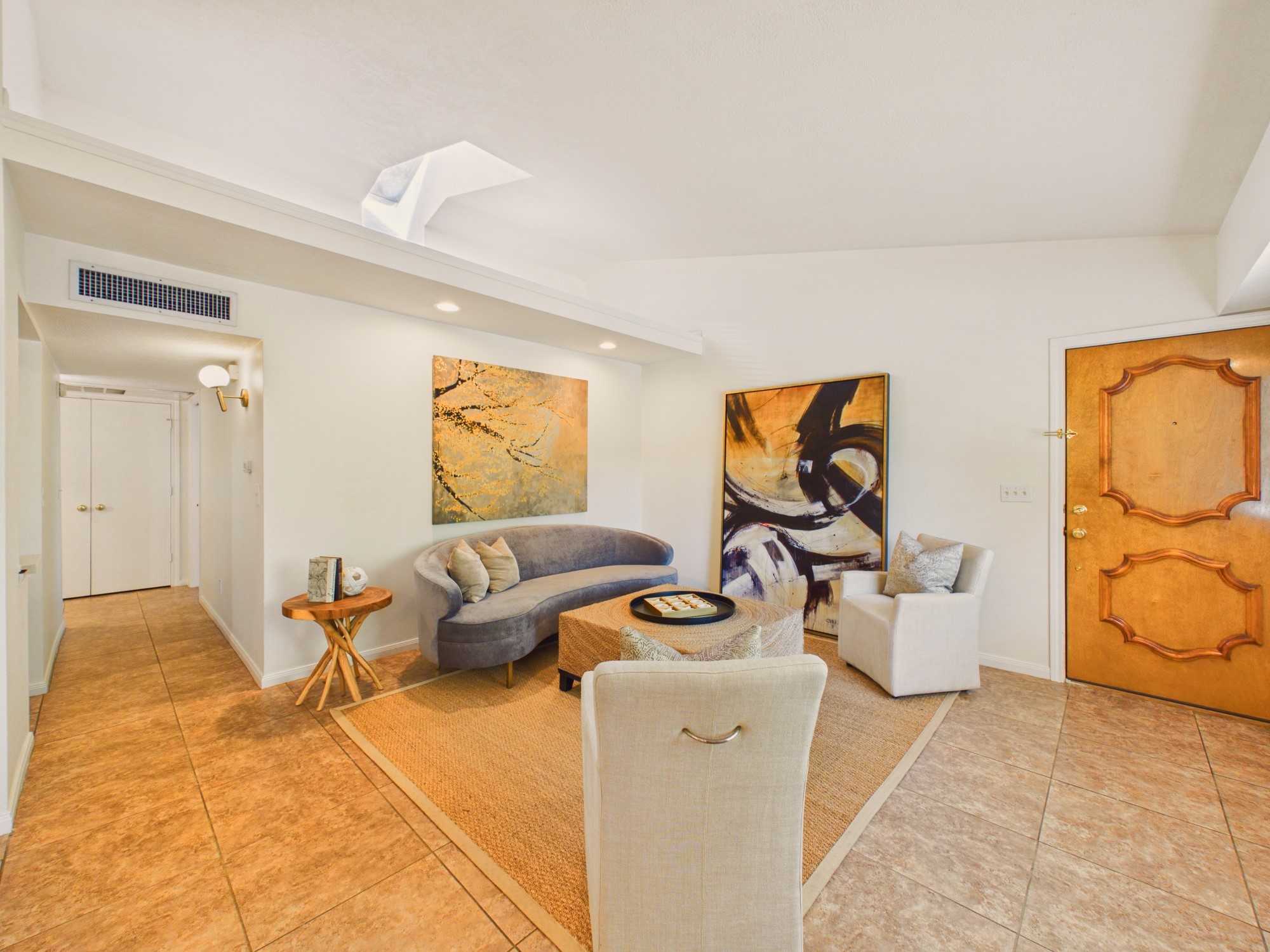 Abundant Natural Light with a High Sloped Ceiling with a Skylight Abundant Natural Light with a High Sloped Ceiling with a Skylight
