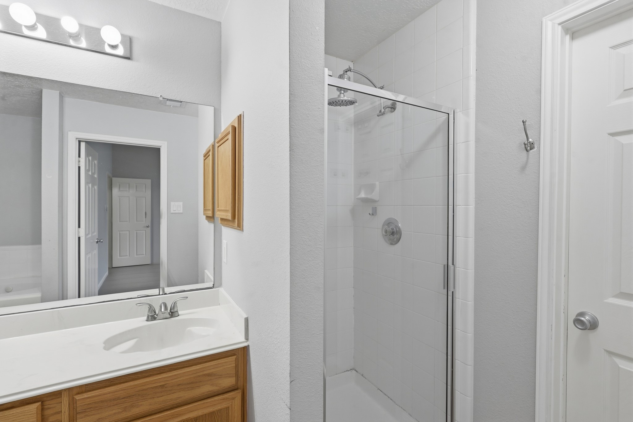 Separate walk-in shower completes the spacious primary bathroom