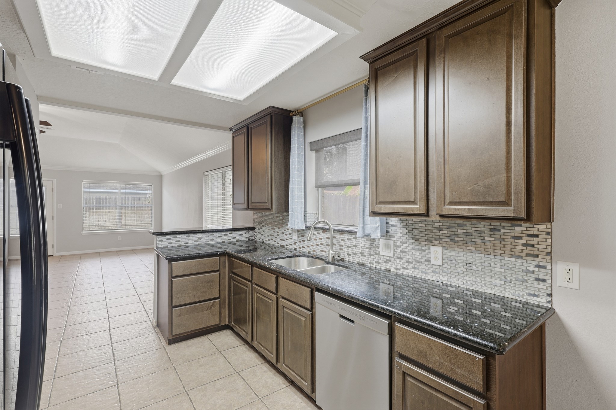 Updated kitchen offers abundant cabinetry and an easy-flow layout