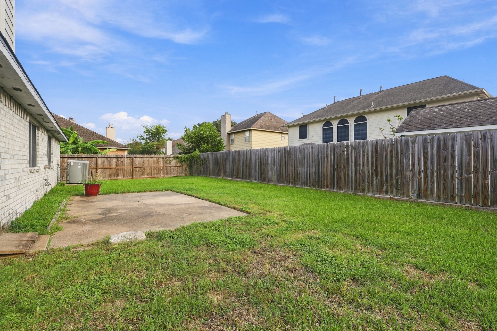 Fully fenced backyard offers plenty of room for outdoor living, pets, play or gardening.