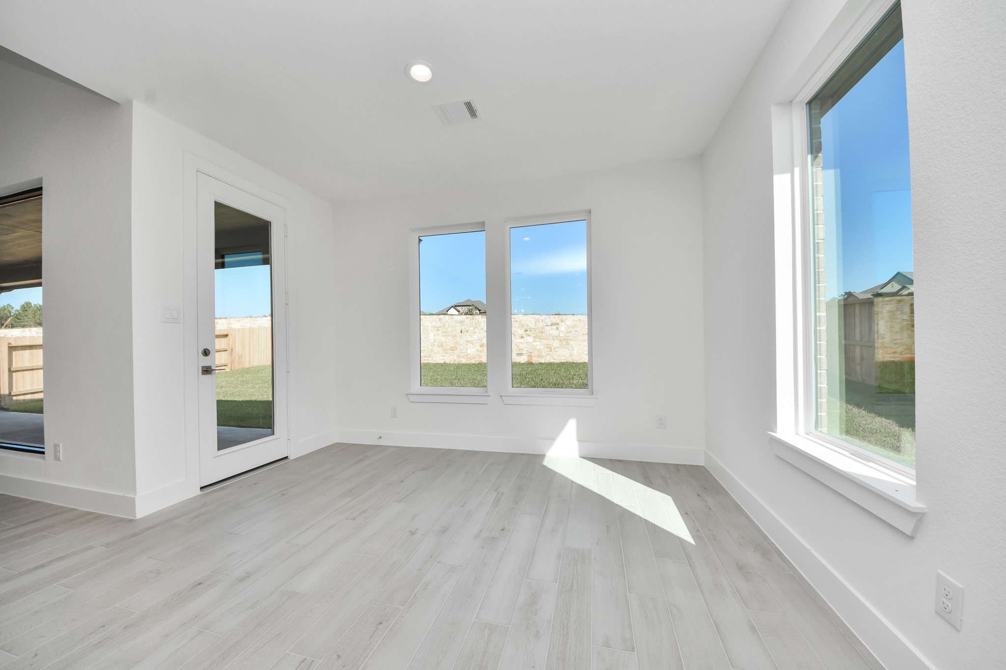 Enjoy breakfast with ease in the connected and cozy breakfast area, seamlessly integrated with the kitchen for utmost convenience. Step through the back door for a breath of fresh air onto the covered patio, extending your living space to the outdoors