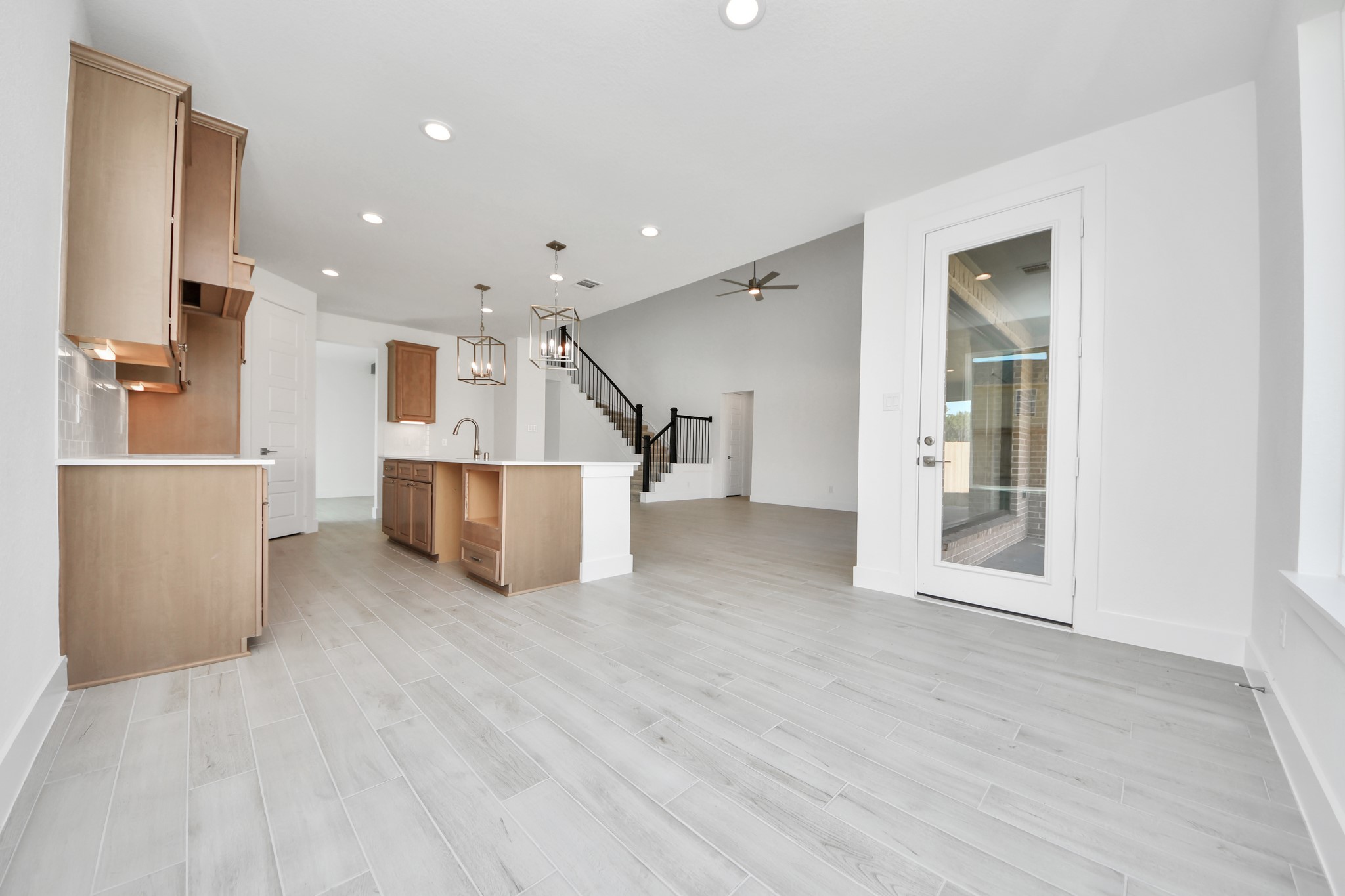 Enjoy breakfast with ease in the connected and cozy breakfast area, seamlessly integrated with the kitchen for utmost convenience. Step through the back door for a breath of fresh air onto the covered patio, extending your living space to the outdoors