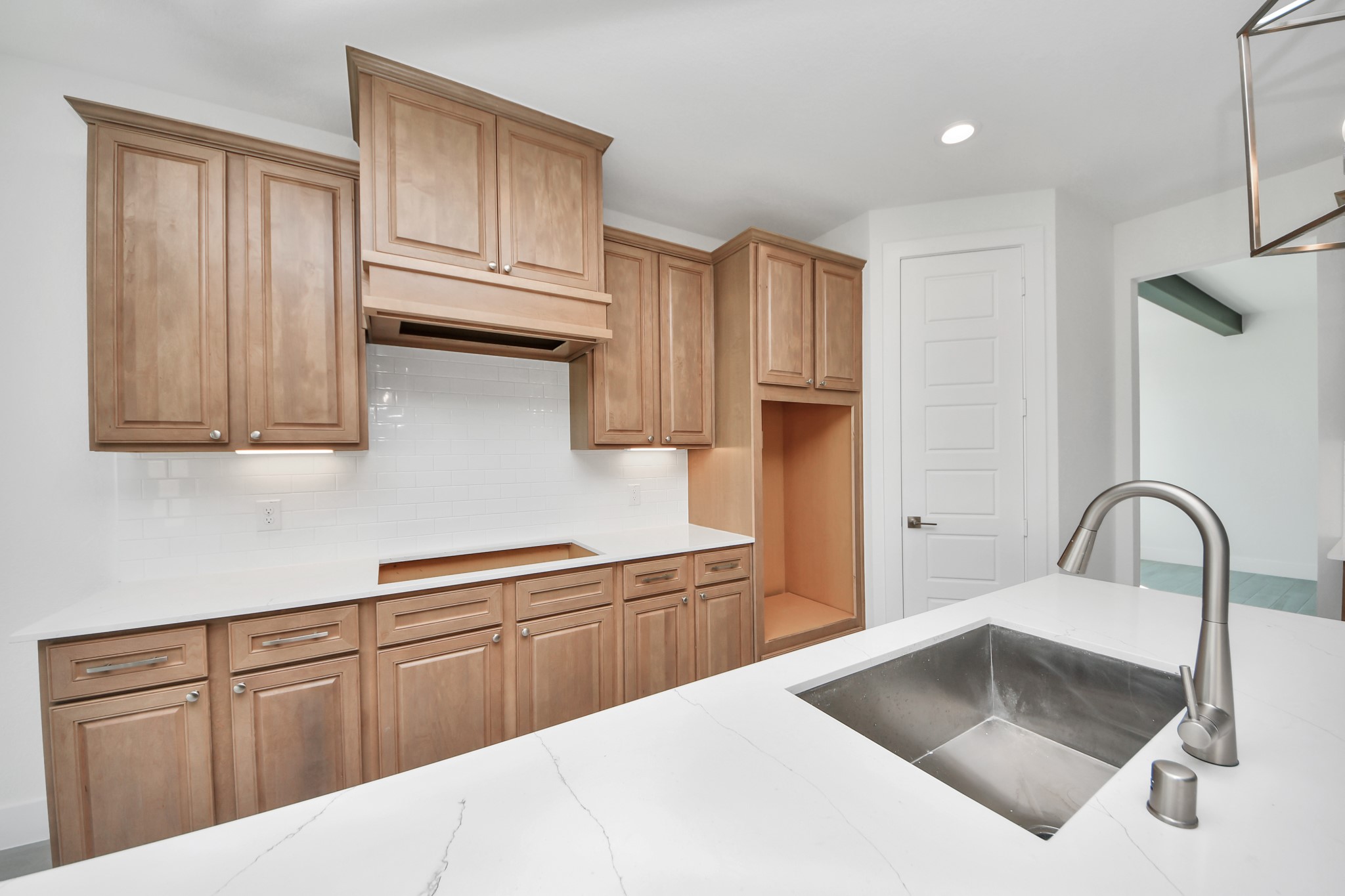 The open concept effortlessly connects the kitchen to the expansive family room, forming a perfect hub for gatherings. This seamless flow creates an inviting space where cooking and socializing come together harmoniously.