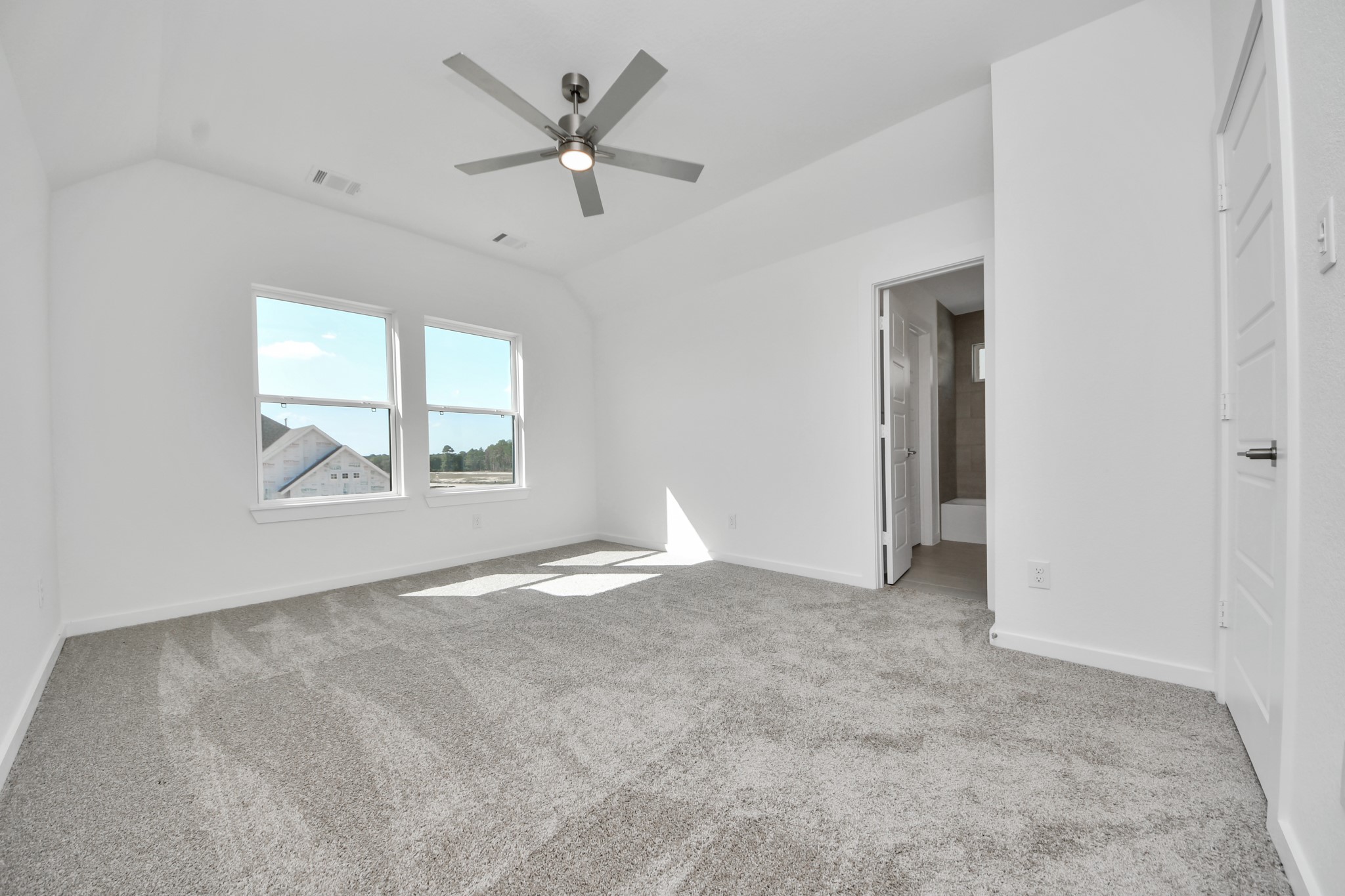 Generously sized secondary bedrooms featuring spacious closets, soft and inviting carpeting underfoot, large windows allowing plenty of natural light, and the added touch of privacy blinds for your personal retreat.