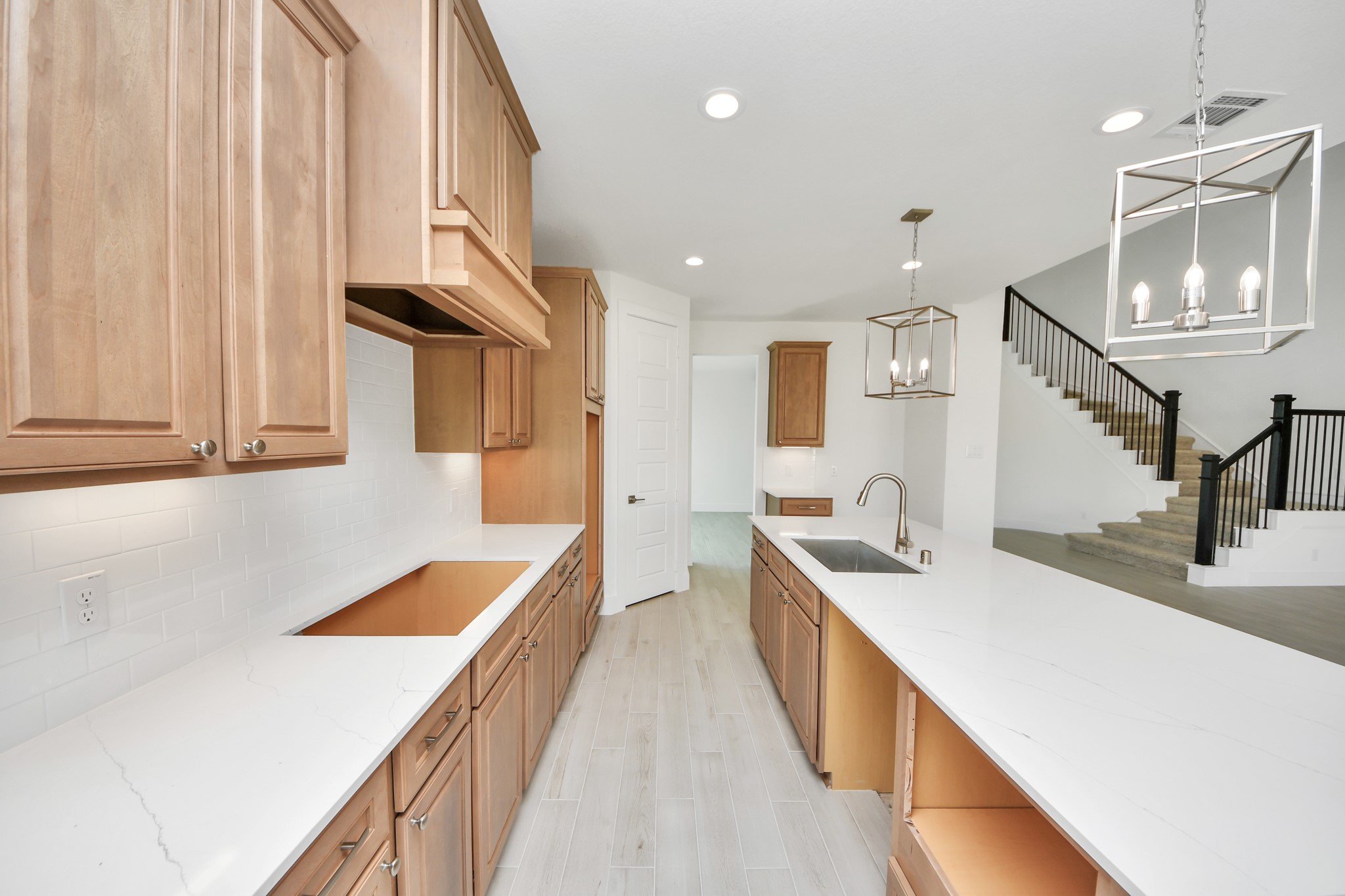 The extended counter area adds both practicality and style, making meal preparation a breeze. Every detail is thoughtfully designed to enhance the kitchen's functionality and aesthetic appeal.