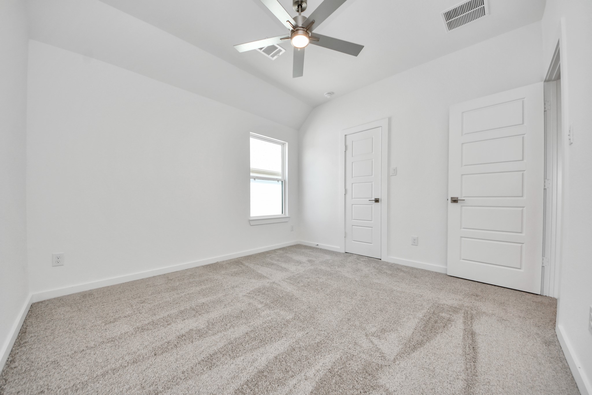 Generously sized secondary bedrooms featuring spacious closets, soft and inviting carpeting underfoot, large windows allowing plenty of natural light, and the added touch of privacy blinds for your personal retreat.