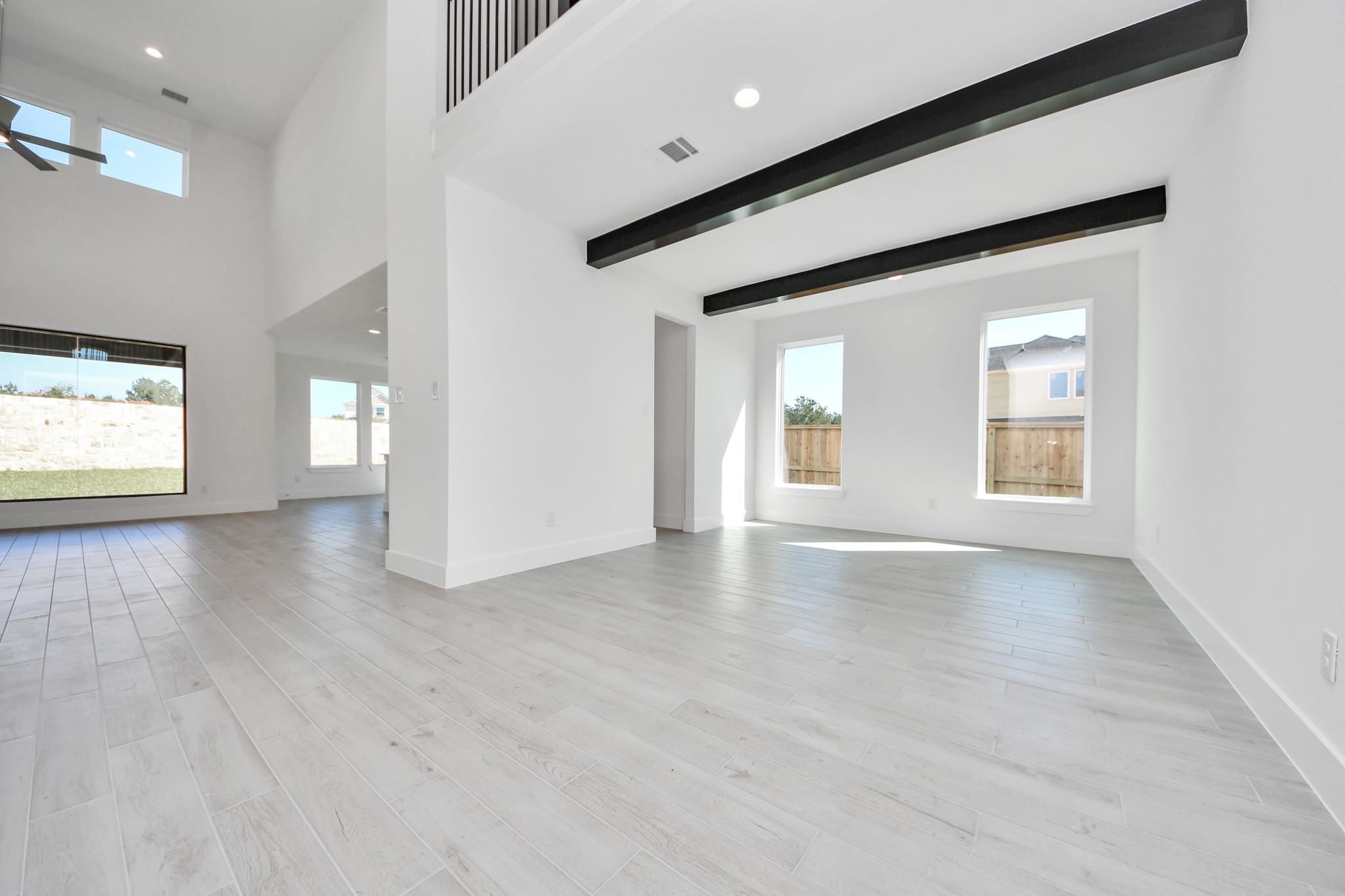 Make memories gathered around the table with your family and friends! This spacious dining room features elegant flooring, custom paint, and adjacent to family room and kitchen for open concept feel.