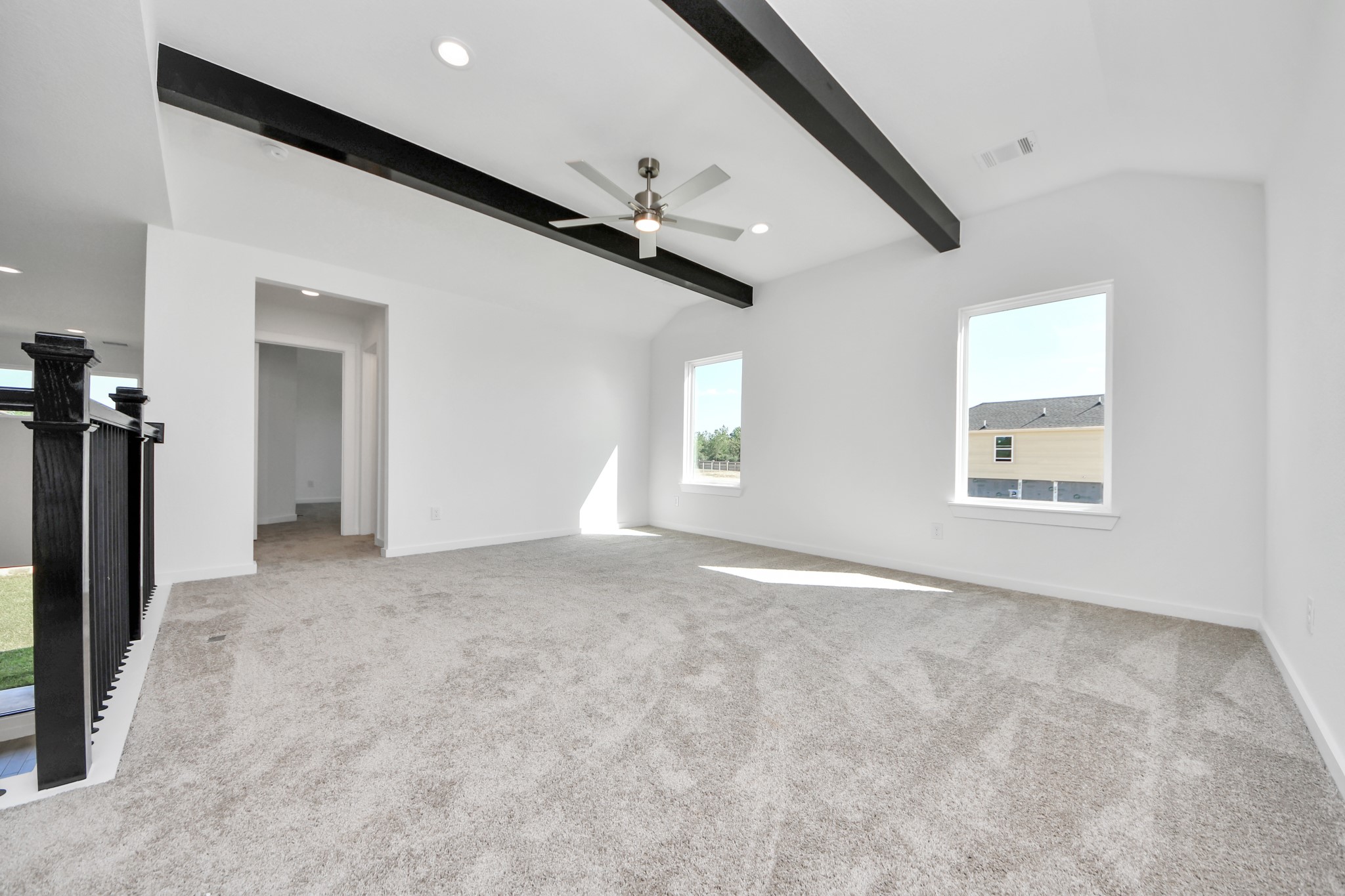 Come upstairs and enjoy a day of leisure in this fabulous game room! This is the perfect hangout spot or adult game room! Features plush carpet, high ceilings, custom paint and windows for plenty of natural light.