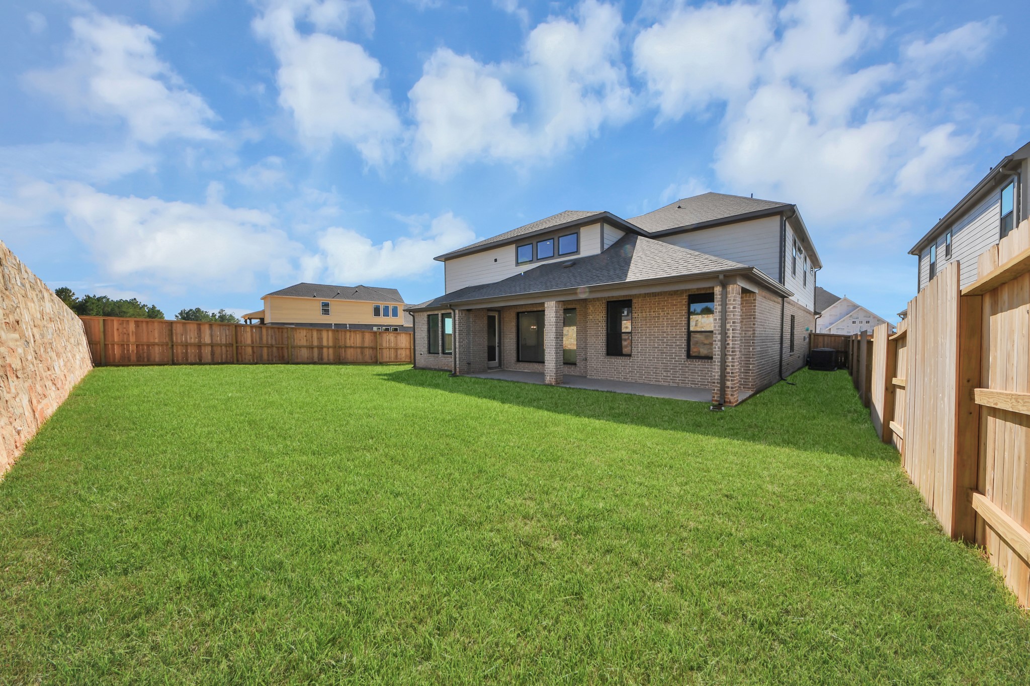 Come and see this spacious backyard with its beautiful covered patio. There is plenty of room for the kids to play and adults to relax. Perfect for your outdoor living space, patio furniture, bbq pit, and so much more. The possibilities are endless!