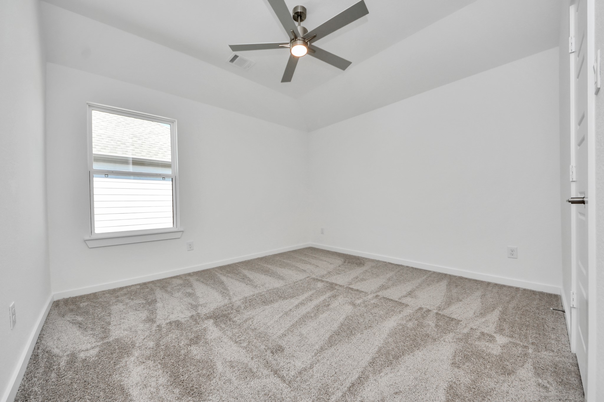 Generously sized secondary bedrooms featuring spacious closets, soft and inviting carpeting underfoot, large windows allowing plenty of natural light, and the added touch of privacy blinds for your personal retreat.