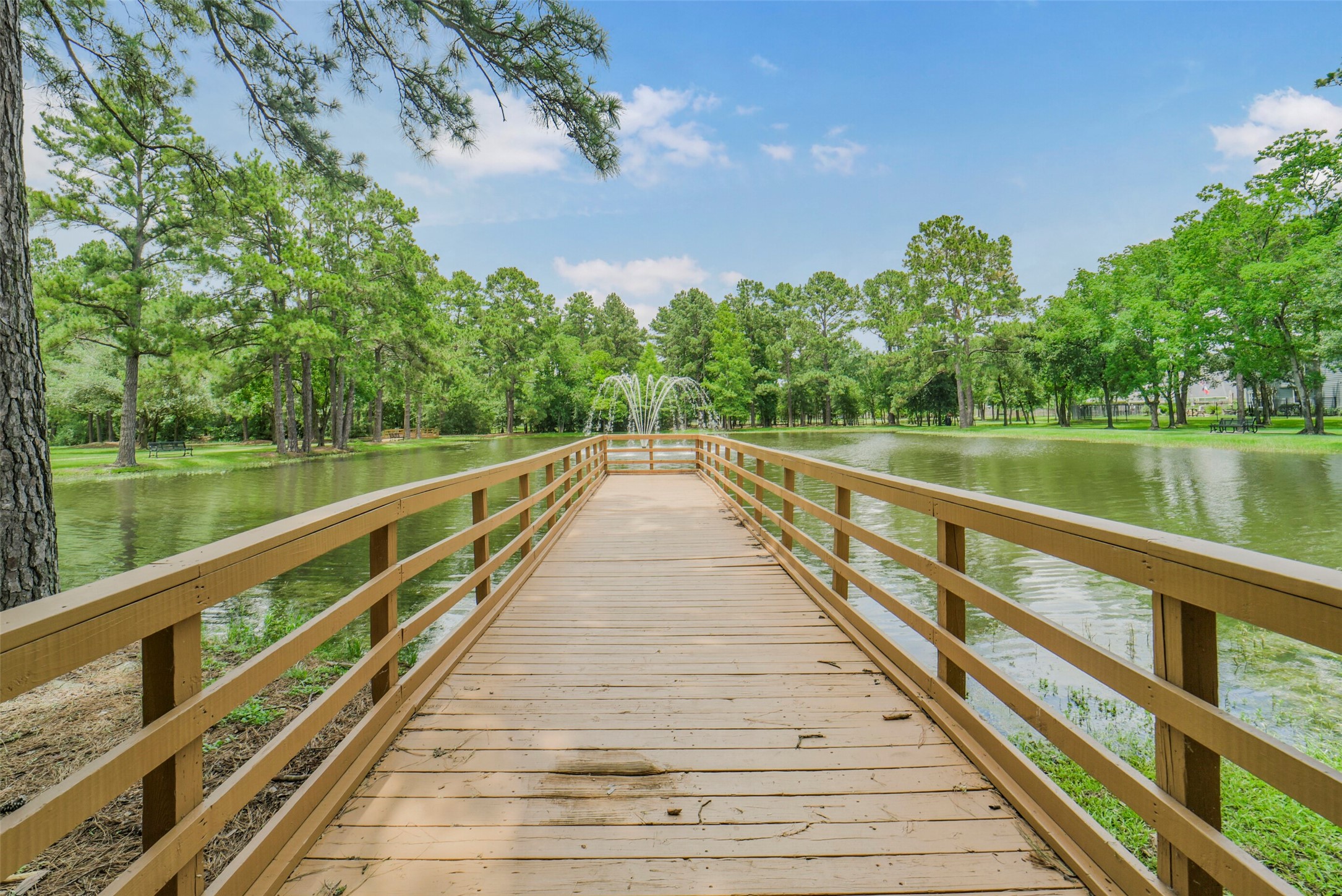 Enjoy peaceful afternoons by the water with direct access to a neighborhood dock, a scenic fishing pond, and a beautiful fountain feature.
