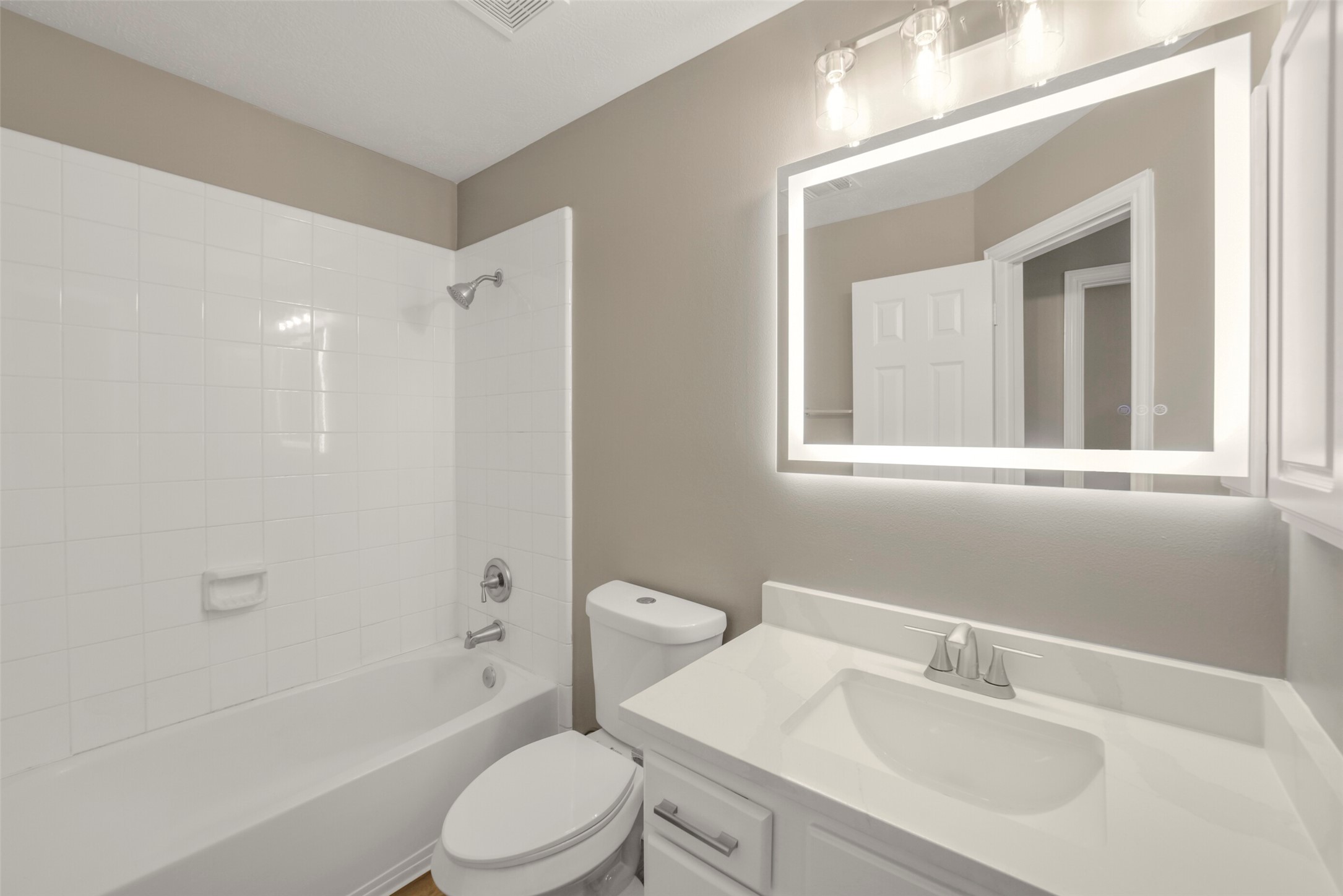 The well-appointed upstairs full bath is perfectly positioned to serve the secondary bedrooms and guests alike.