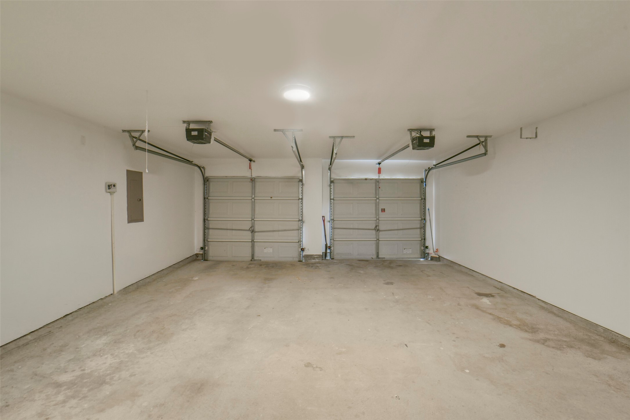 The attached 2-car garage provides secure parking, additional storage potential, and easy access to the home.
