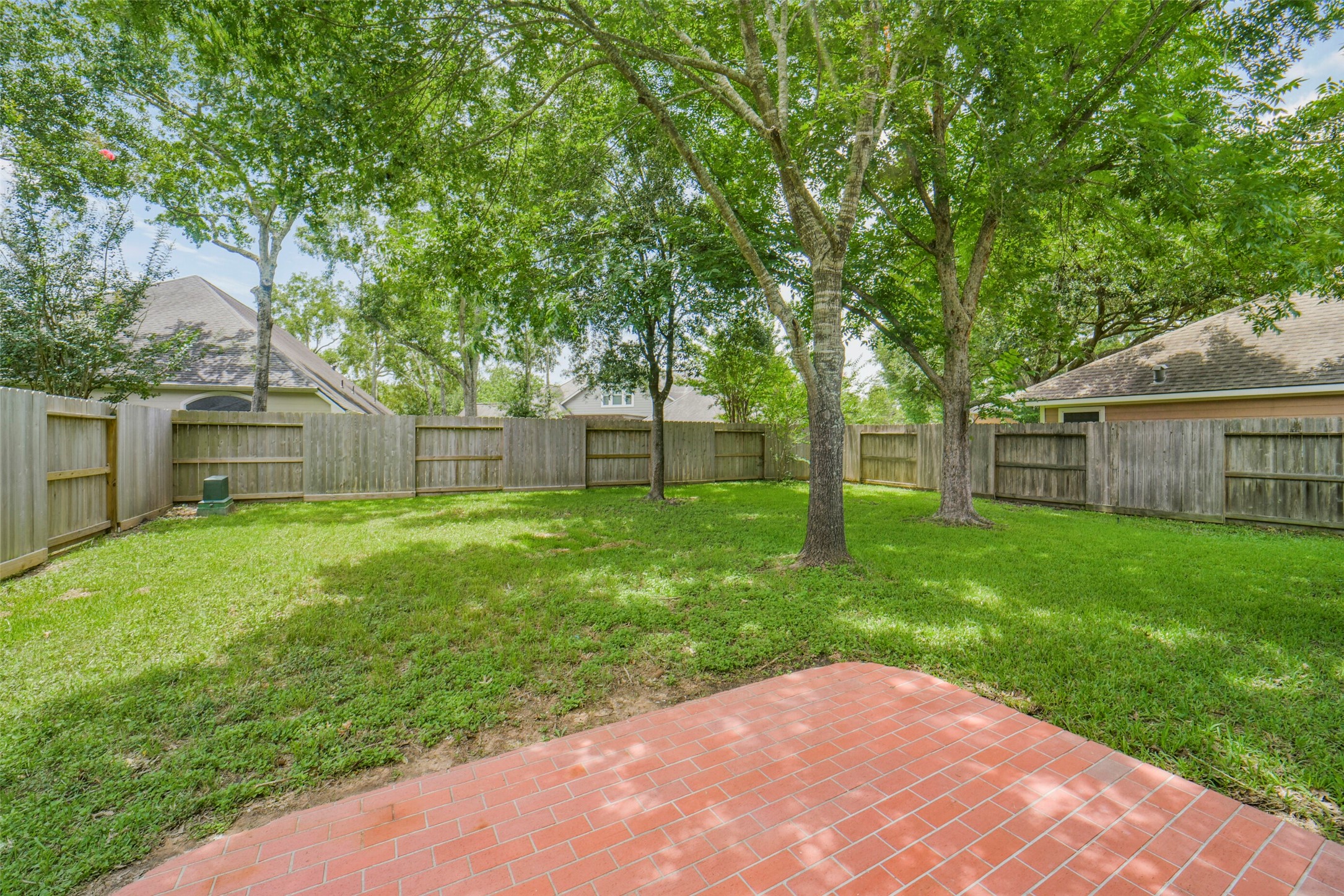 The expansive backyard provides an ideal setting for outdoor entertaining, gardening, or relaxing in your own private retreat.