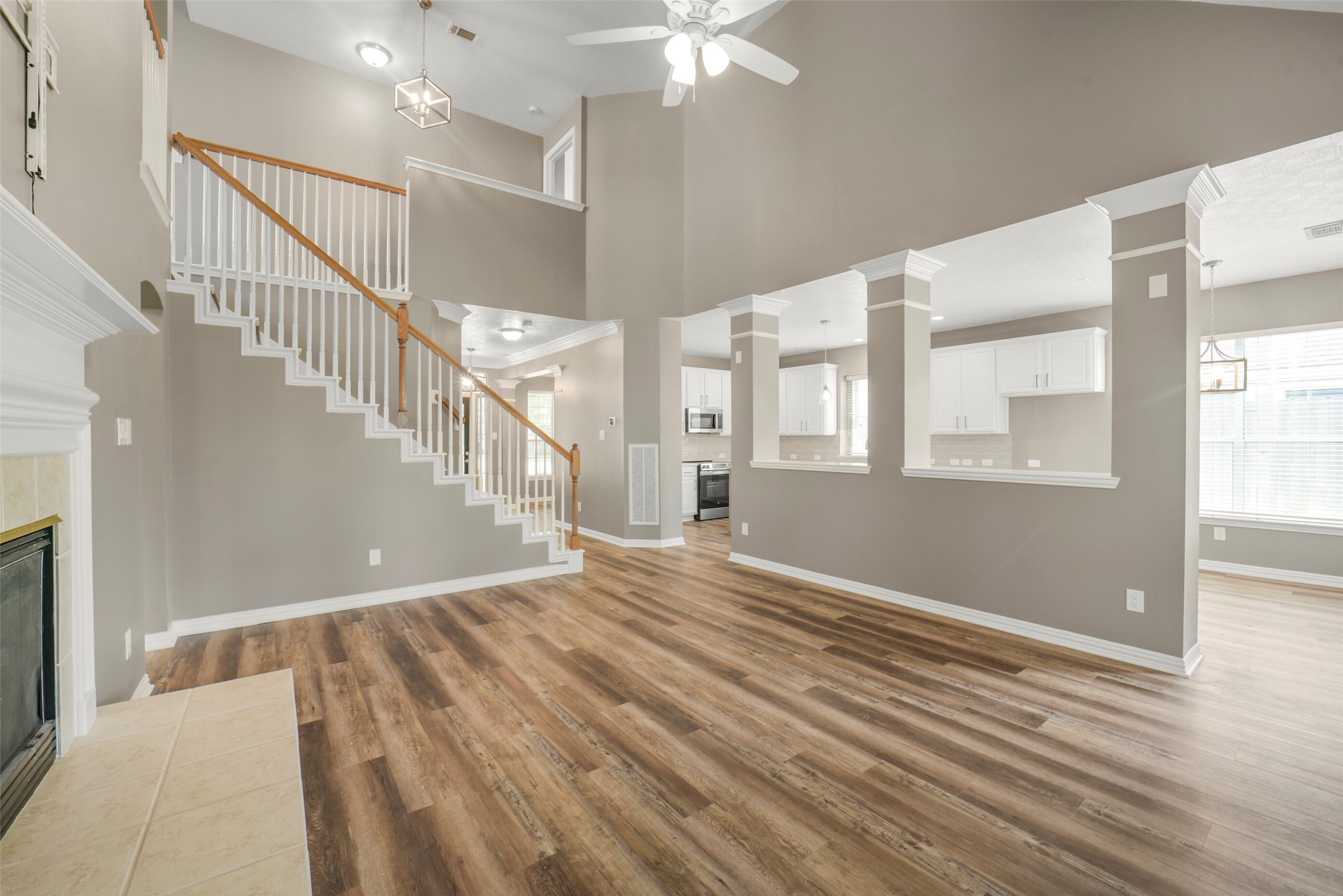 A secondary view of the living room showcases the open-concept design, effortlessly overlooked by the chef's kitchen.